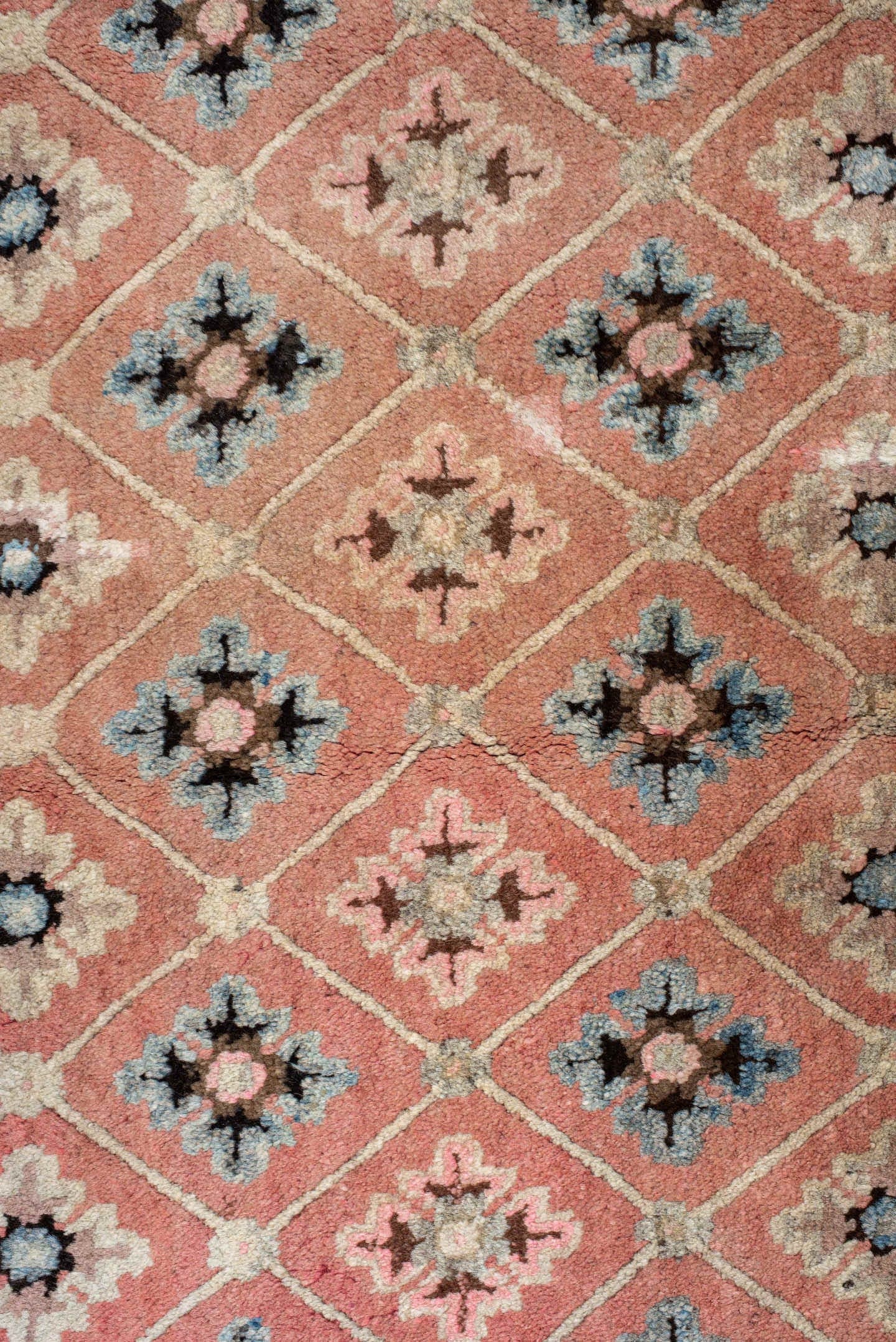 4' x 7' one-of-a-kind handmade vintage Tibetan rug. Color palette: salmon, charcoal, sky blue, ivory, rose, taupe, brown