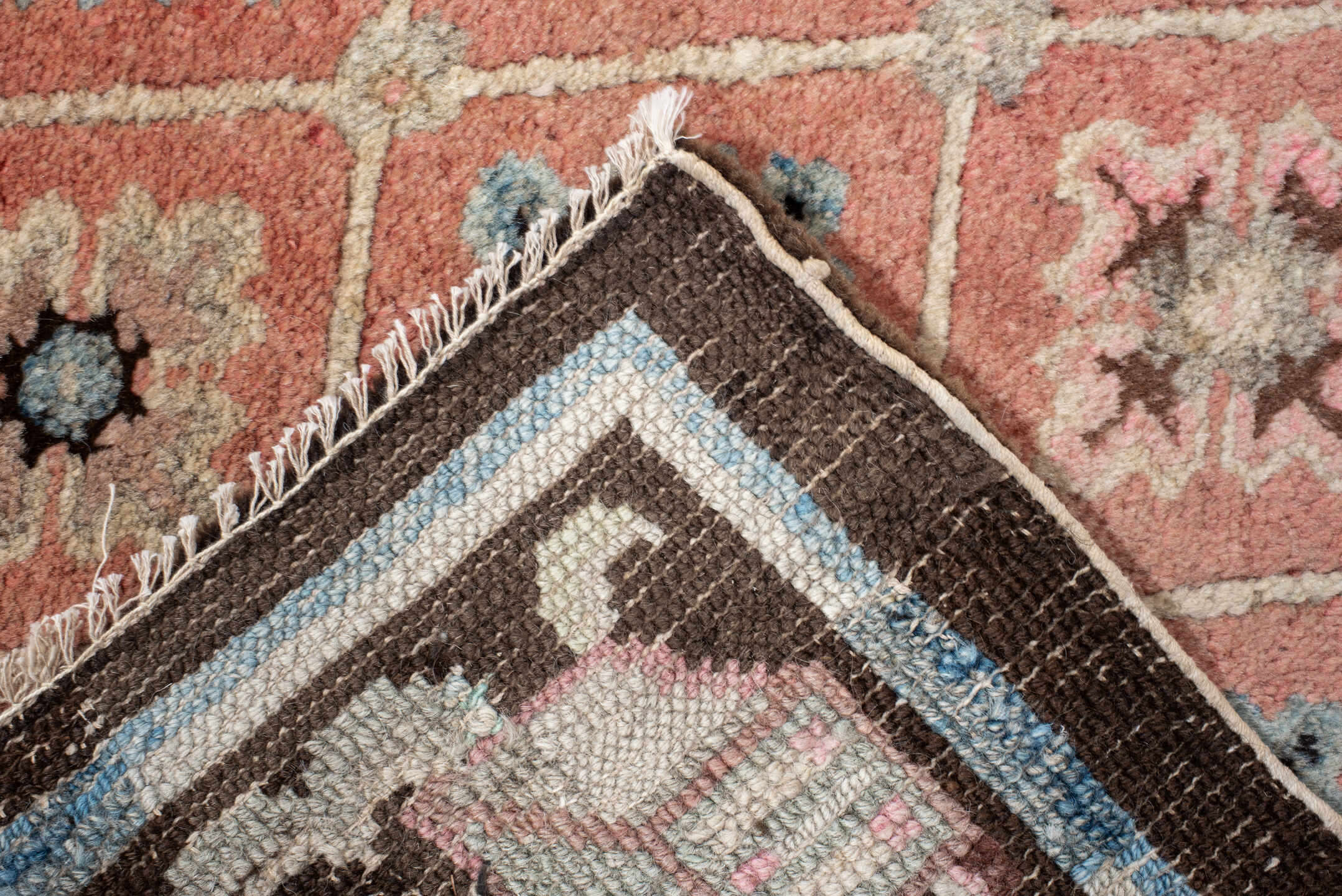 4' x 7' one-of-a-kind handmade vintage Tibetan rug. Color palette: salmon, charcoal, sky blue, ivory, rose, taupe, brown