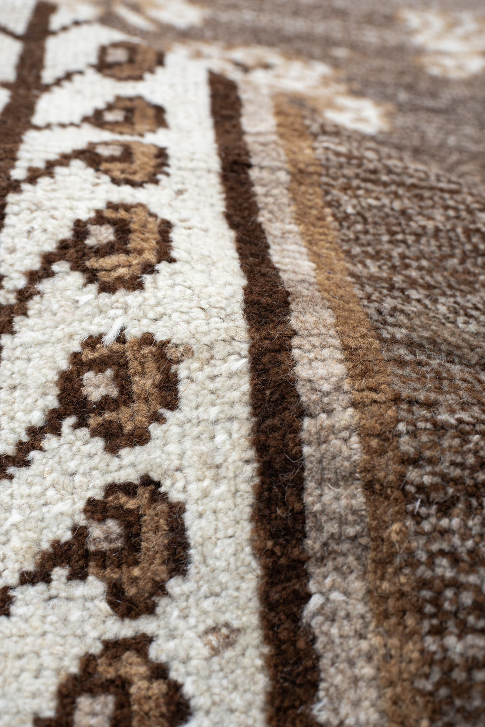 4' x 7' one-of-a-kind handmade vintage Gabbe rug. Color palette: brown, ivory, taupe, camel, beige, gray