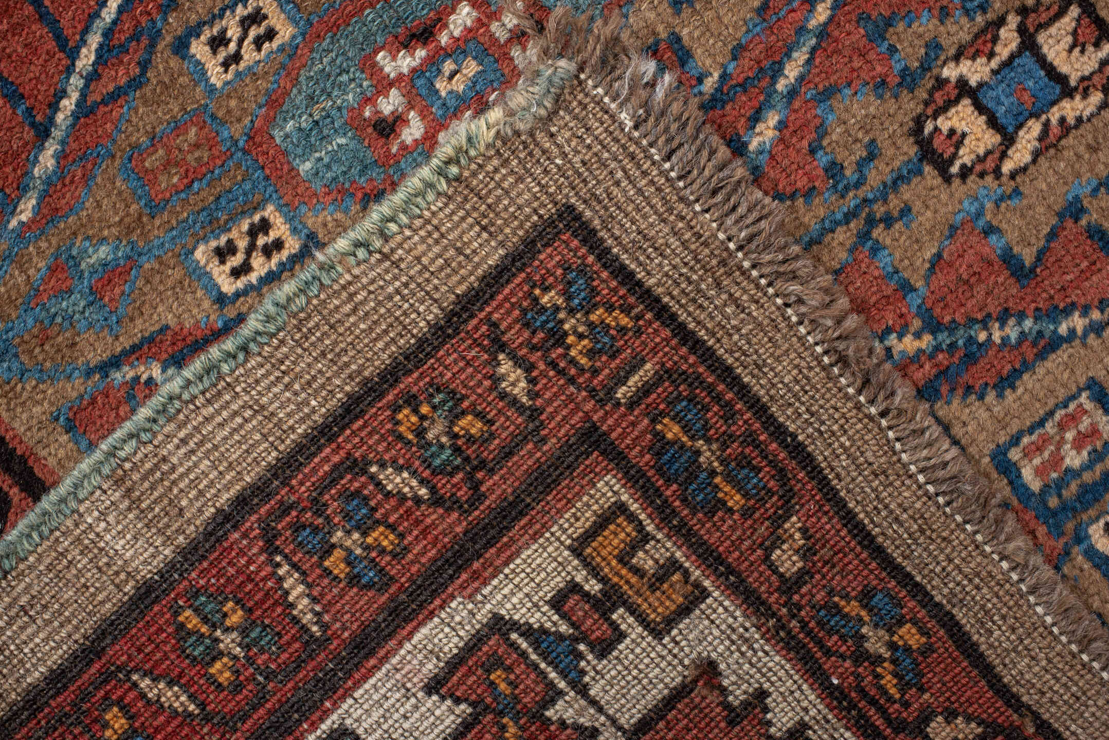 3' x 10' one-of-a-kind handmade vintage NW Persian runner rug. Color palette: camel, rust, ivory, indigo, terra cotta, brown