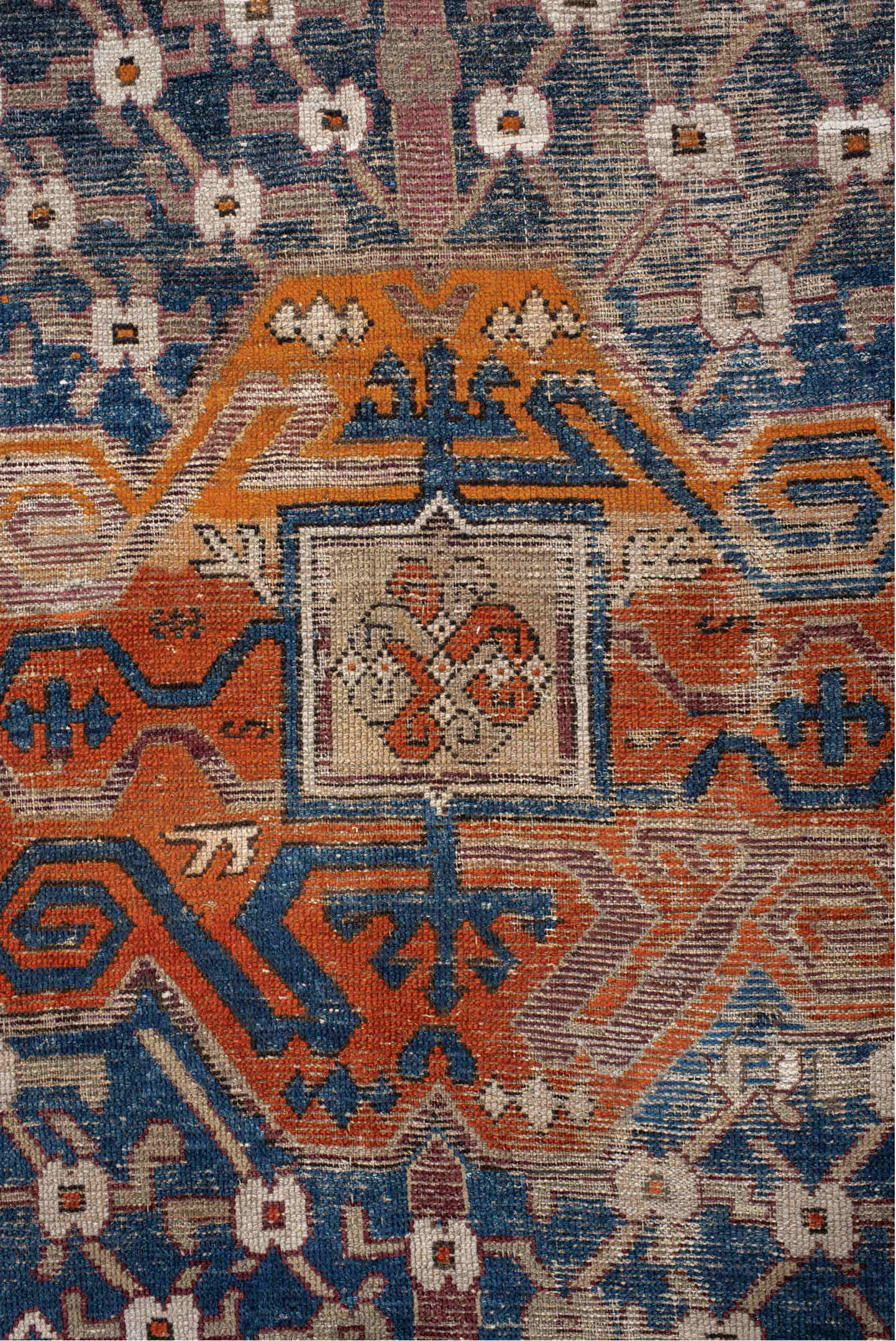 6' x 11' one-of-a-kind handmade vintage Caucasian large size rug. Color palette: black, blue, brown, gray, pink