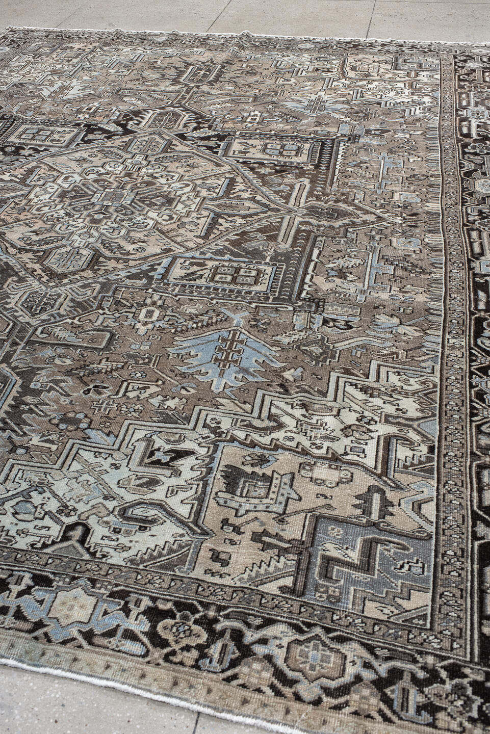 9' x 12' one-of-a-kind handmade antique Heriz large size rug. Color palette: taupe, charcoal, ivory, pale blue, brown, slate