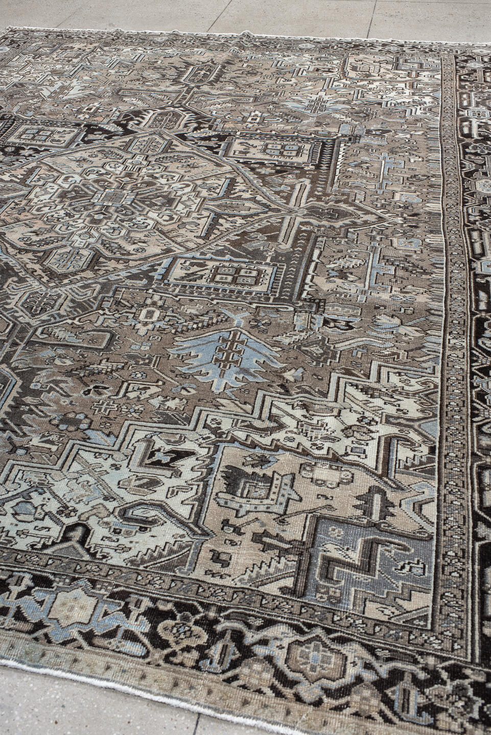 9' x 12' one-of-a-kind handmade antique Heriz large size rug. Color palette: taupe, charcoal, ivory, pale blue, brown, slate