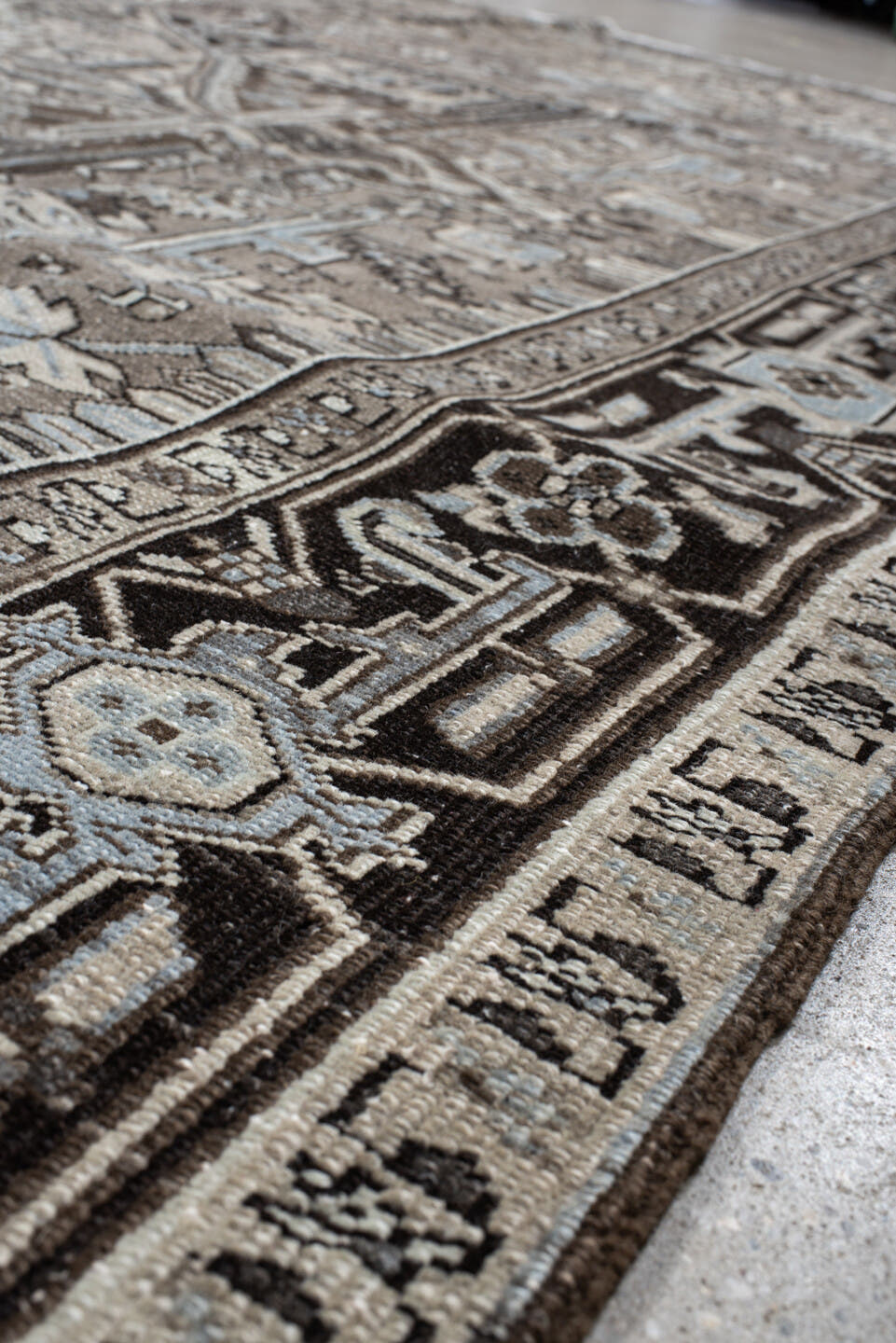 9' x 12' one-of-a-kind handmade antique Heriz large size rug. Color palette: taupe, charcoal, ivory, pale blue, brown, slate