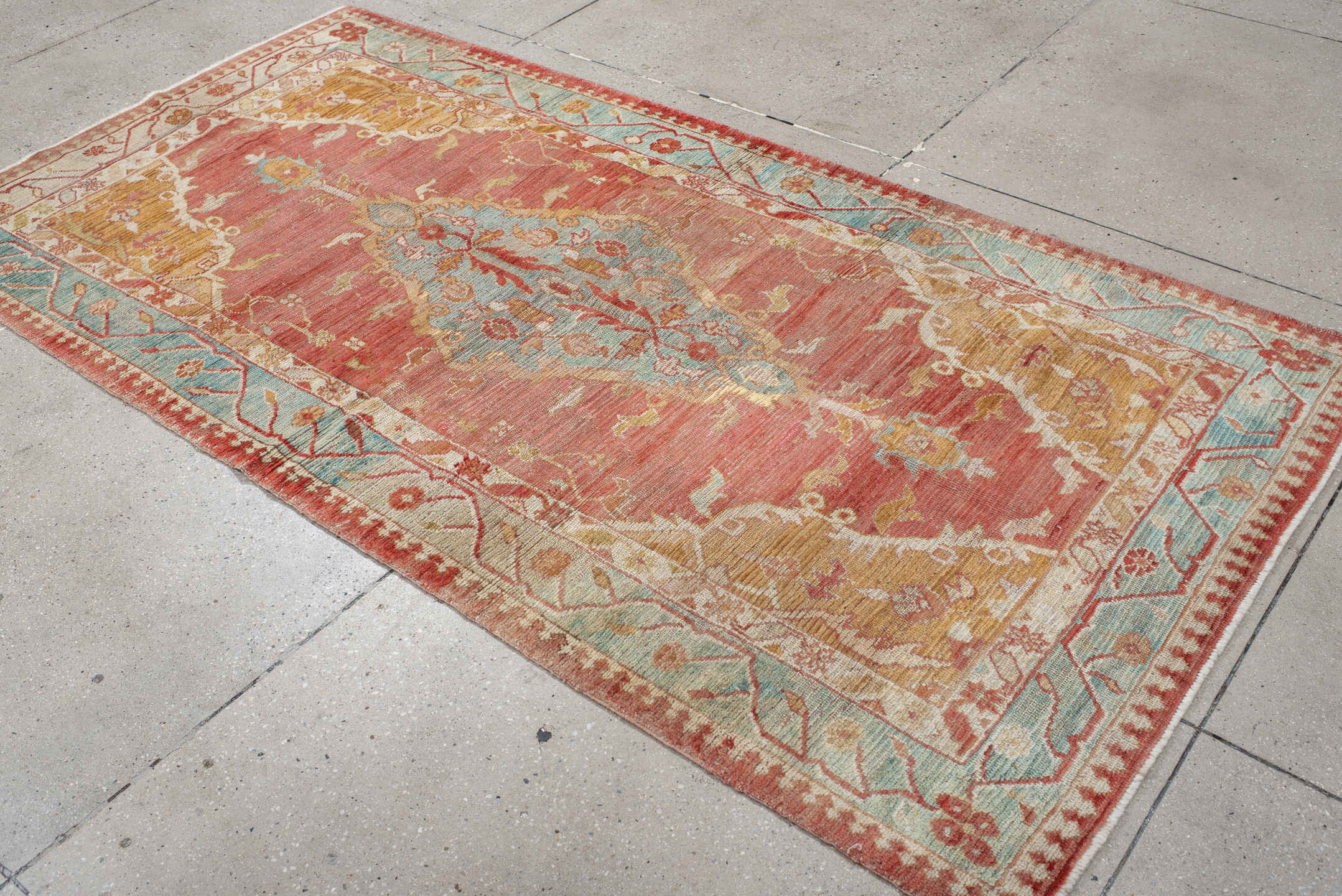 4' x 7' one-of-a-kind handmade vintage Oushak rug. Color palette: rose, aqua, ivory, peach, rust, gold, beige, pink, red