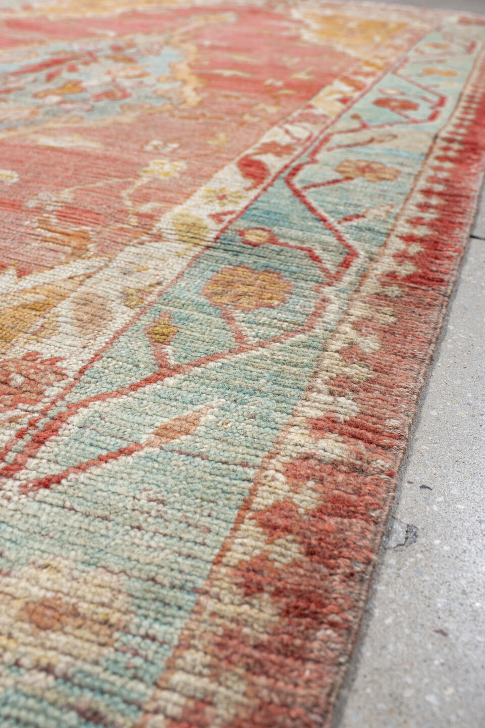 4' x 7' one-of-a-kind handmade vintage Oushak rug. Color palette: rose, aqua, ivory, peach, rust, gold, beige, pink, red