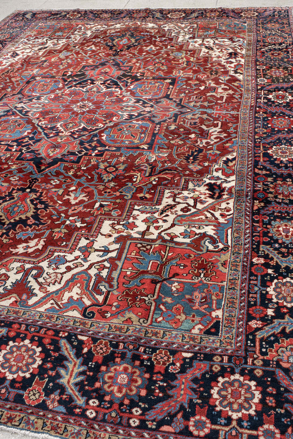 9' x 13' one-of-a-kind handmade antique Heriz large size rug. Color palette: rust, navy, ivory, sky_blue, crimson, camel