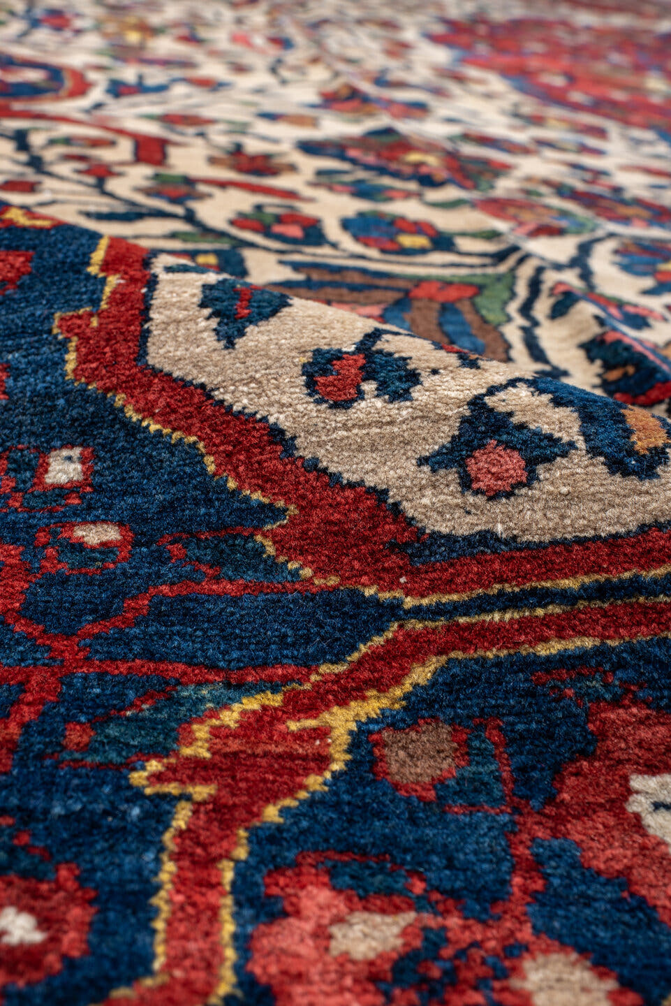 14' x 16' one-of-a-kind handmade vintage Baktiary oversize rug. Color palette: ivory, rust, navy, terracotta, indigo, rose