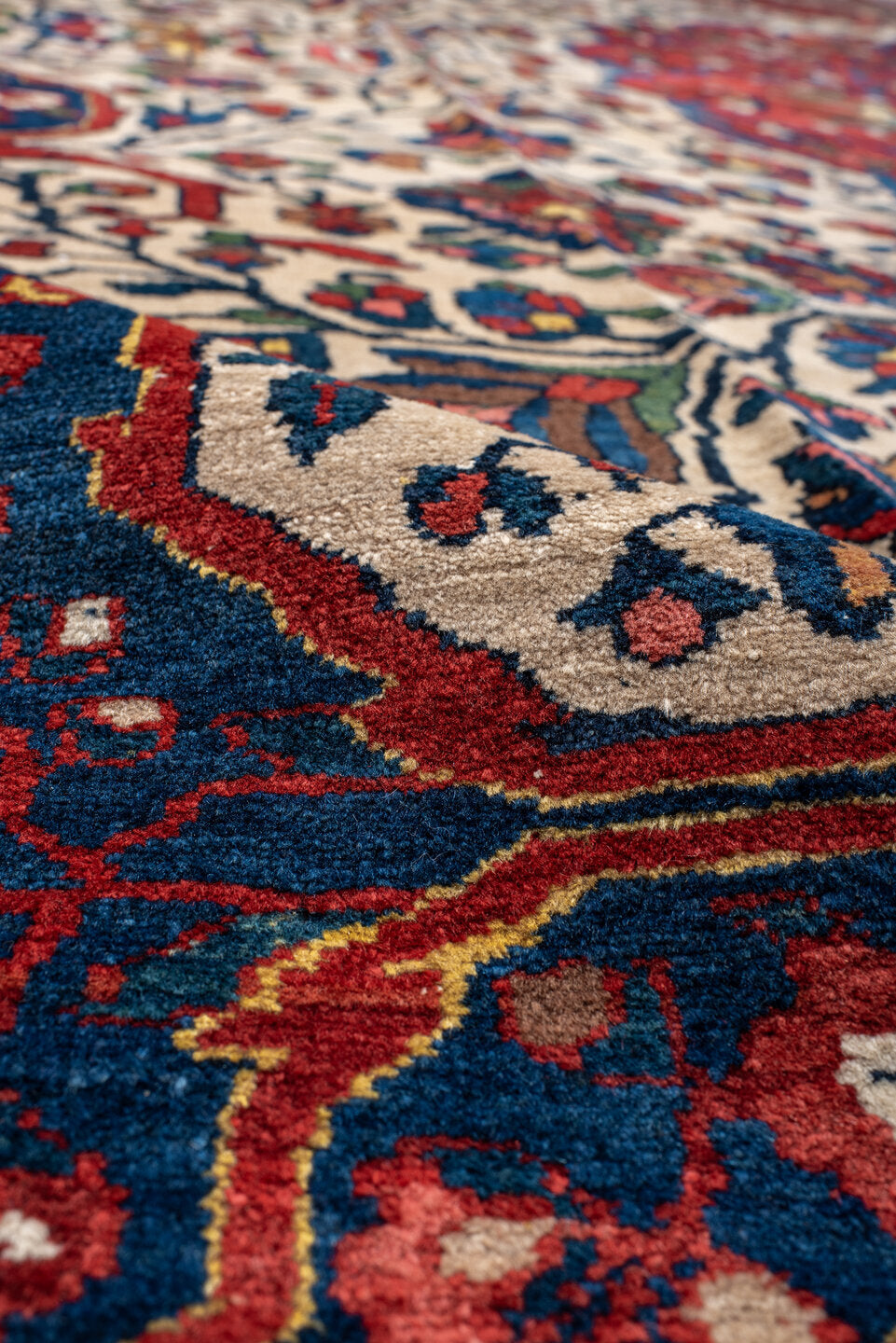 14' x 16' one-of-a-kind handmade vintage Baktiary oversize rug. Color palette: ivory, rust, navy, terracotta, indigo, rose
