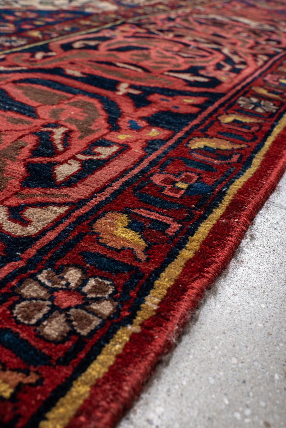 14' x 16' one-of-a-kind handmade vintage Baktiary oversize rug. Color palette: ivory, rust, navy, terracotta, indigo, rose