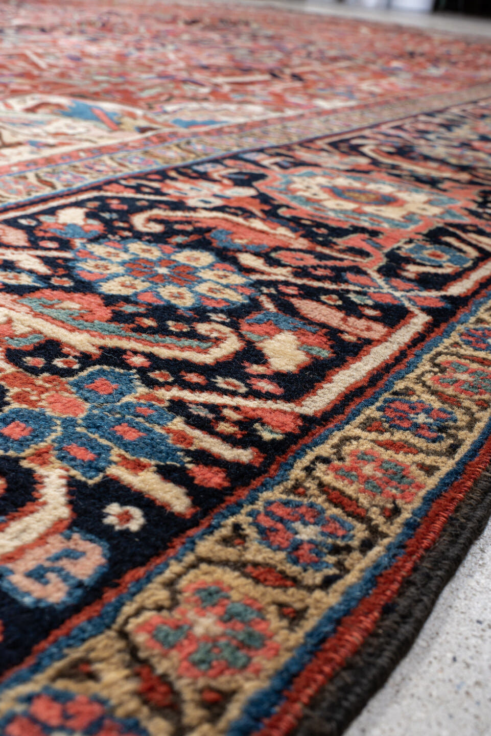 11' x 15' one-of-a-kind handmade vintage Heriz oversize rug. Color palette: rust, ivory, navy, sky_blue, rose, teal