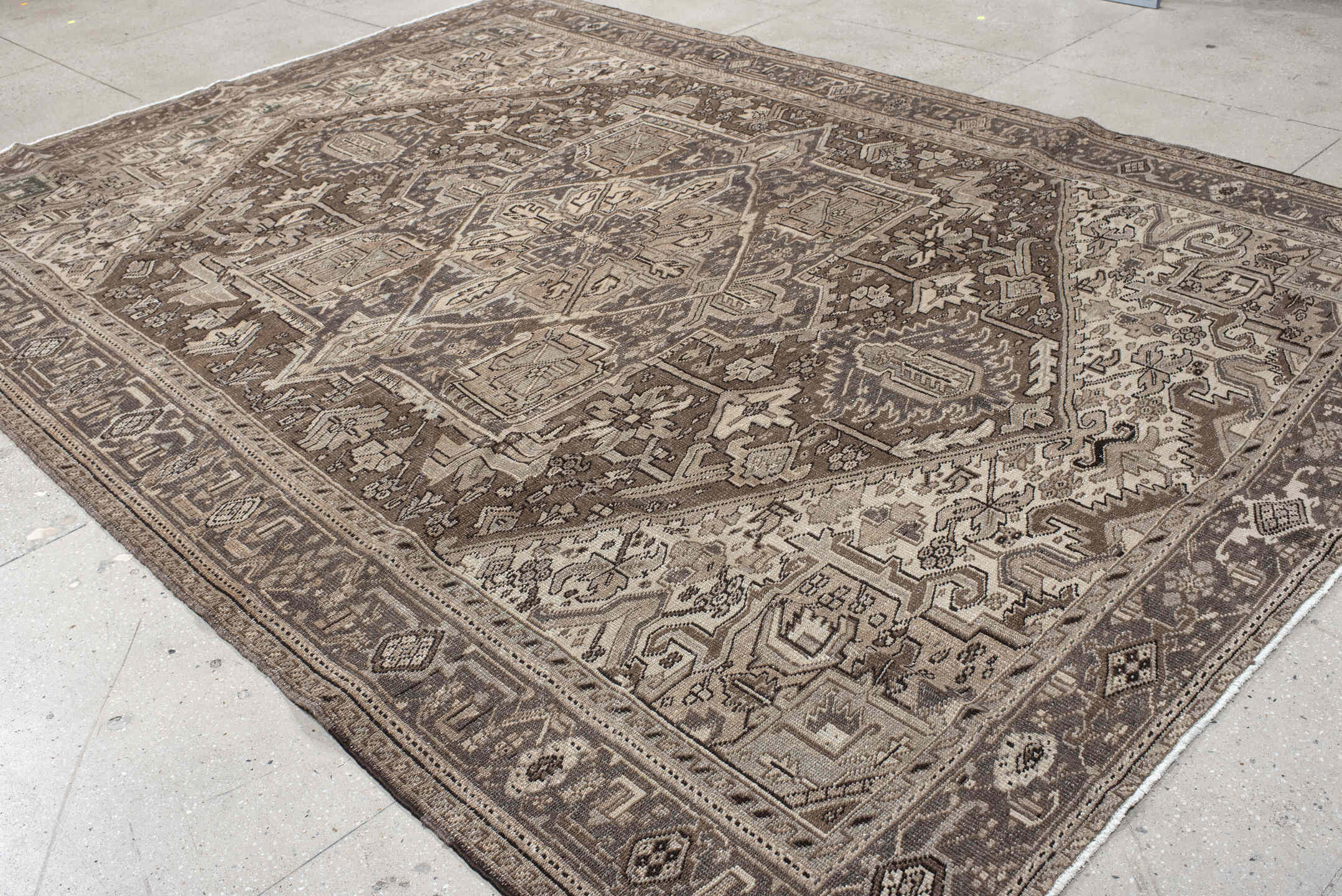 8' x 12' one-of-a-kind handmade antique Heriz large size rug. Color palette: taupe, brown, ivory, camel, charcoal, sage
