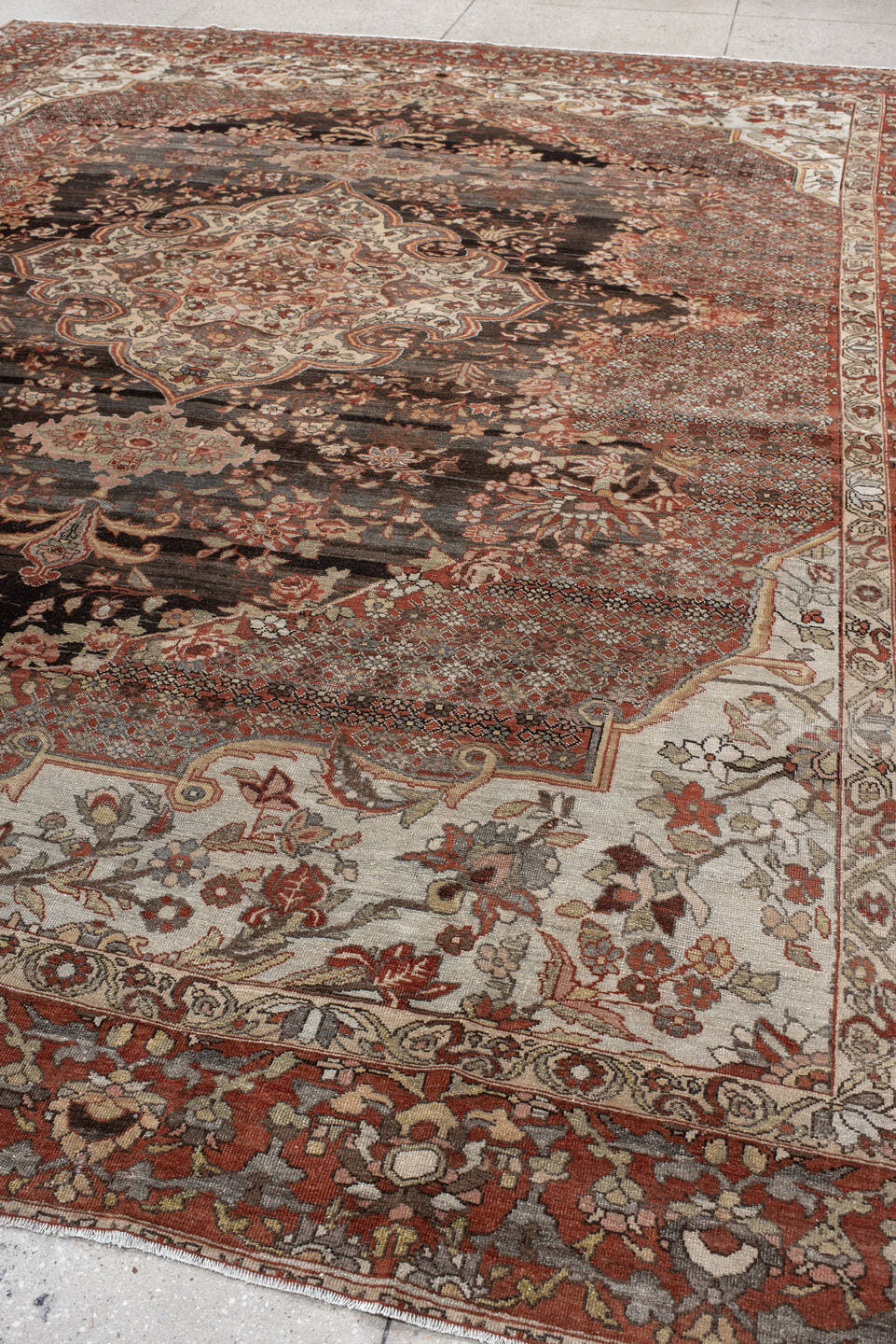 10' x 13' one-of-a-kind handmade antique Baktiary large size rug. Color palette: rust, charcoal, ivory, taupe, terra cotta