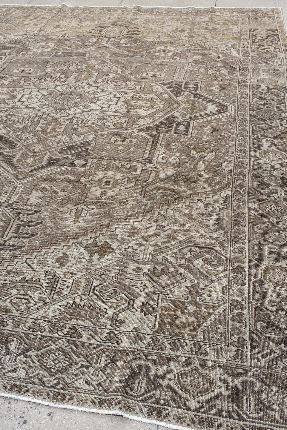 9' x 12' one-of-a-kind handmade antique Heriz large size rug. Color palette: taupe, ivory, brown, camel, charcoal, beige