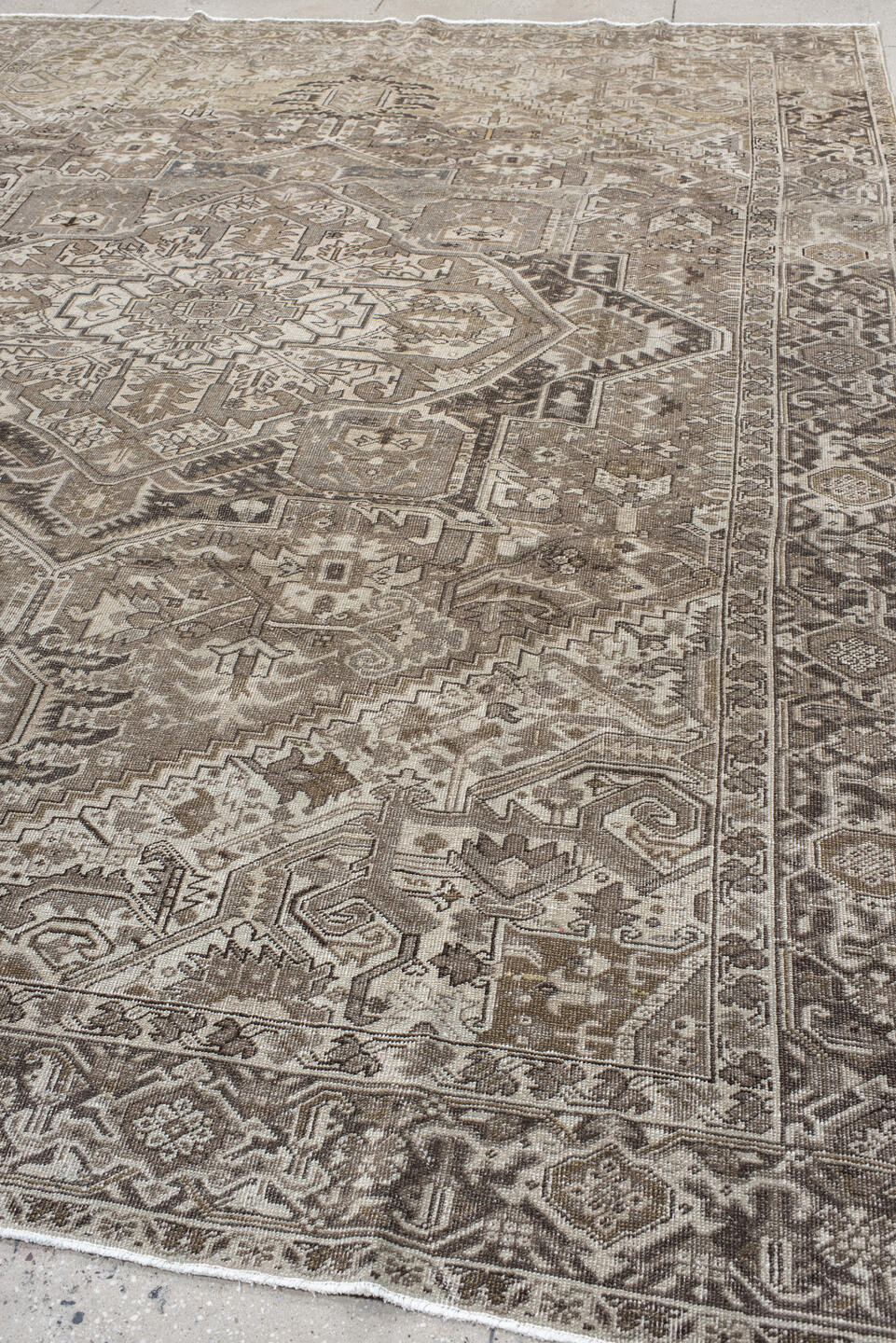 9' x 12' one-of-a-kind handmade antique Heriz large size rug. Color palette: taupe, ivory, brown, camel, charcoal, beige