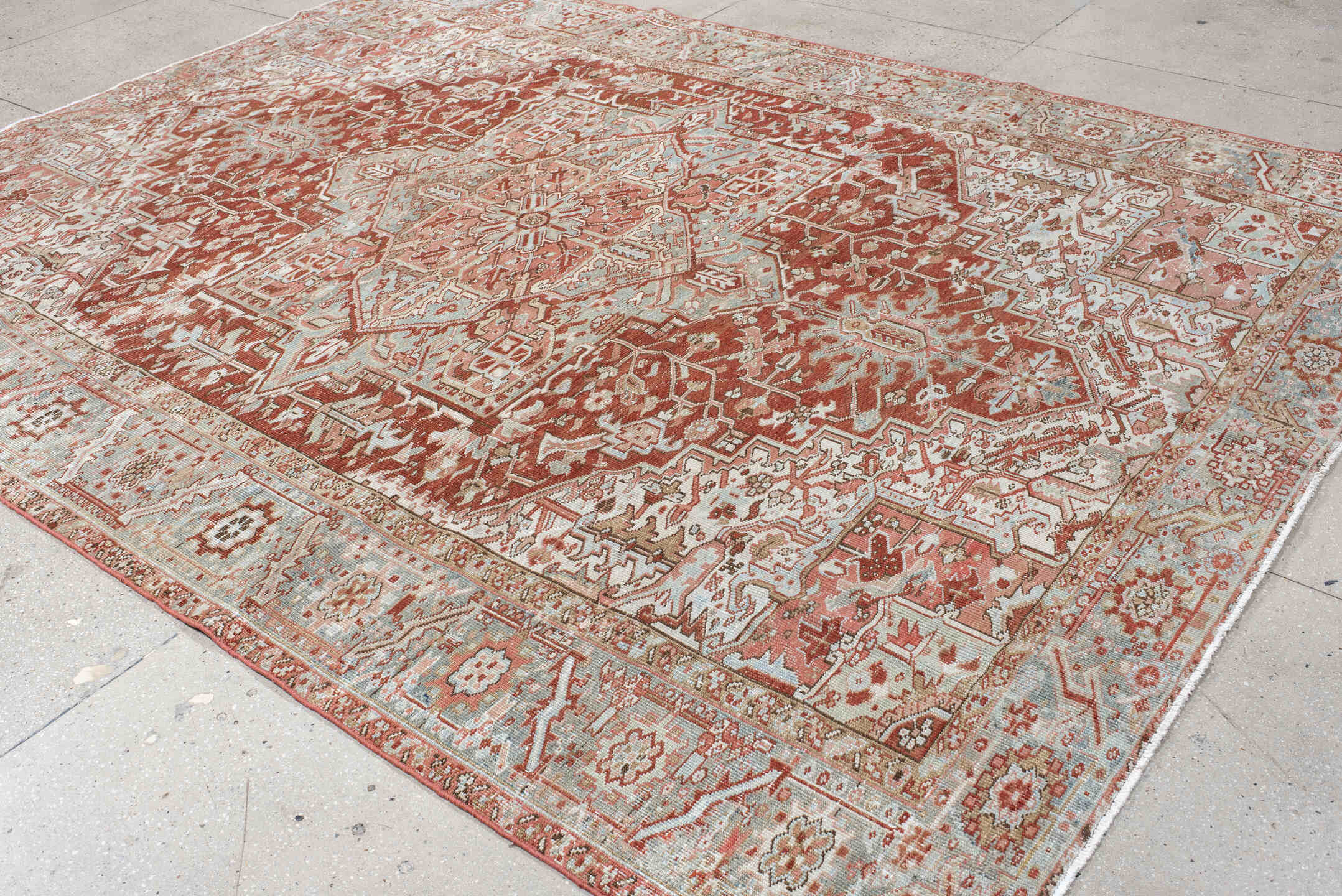 8' x 11' one-of-a-kind handmade vintage Heriz large size rug. Color palette: rust, pale blue, ivory, terra cotta, taupe