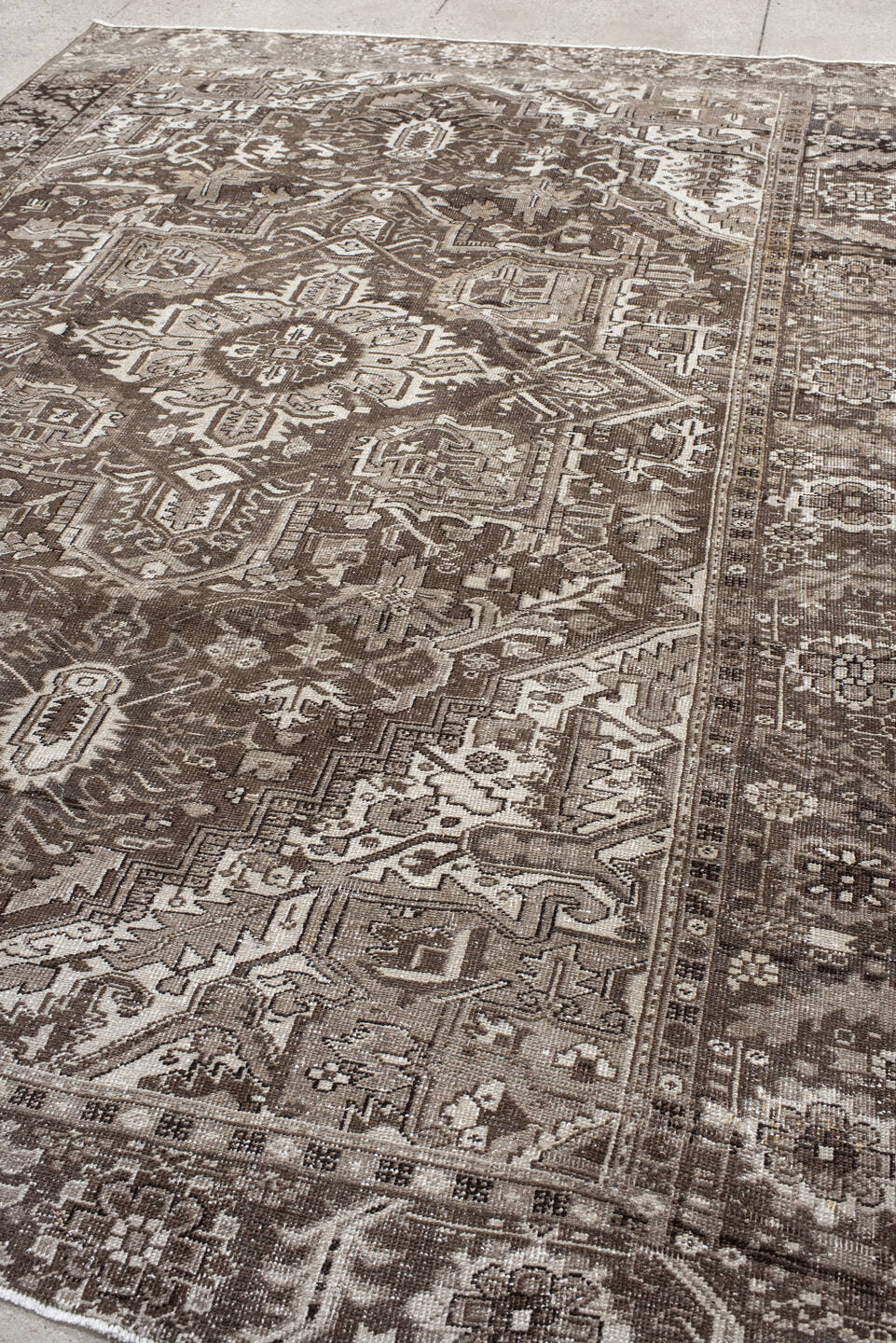 7' x 10' one-of-a-kind handmade antique Heriz large size rug. Color palette: taupe, brown, ivory, charcoal, camel, beige