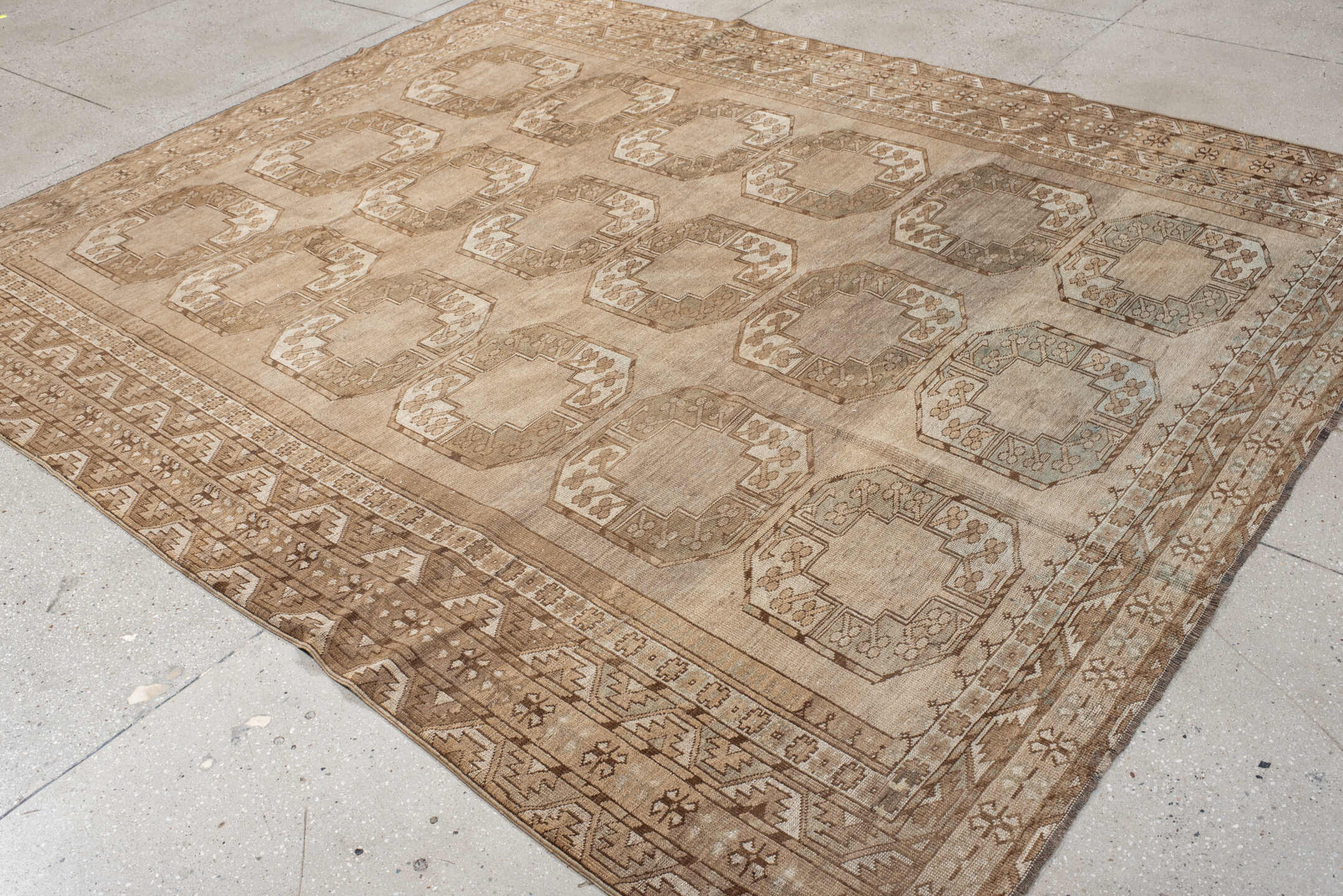 7' x 9' one-of-a-kind handmade antique Afghan rug. Color palette: taupe, camel, beige, ivory, sand, light brown, pale blue