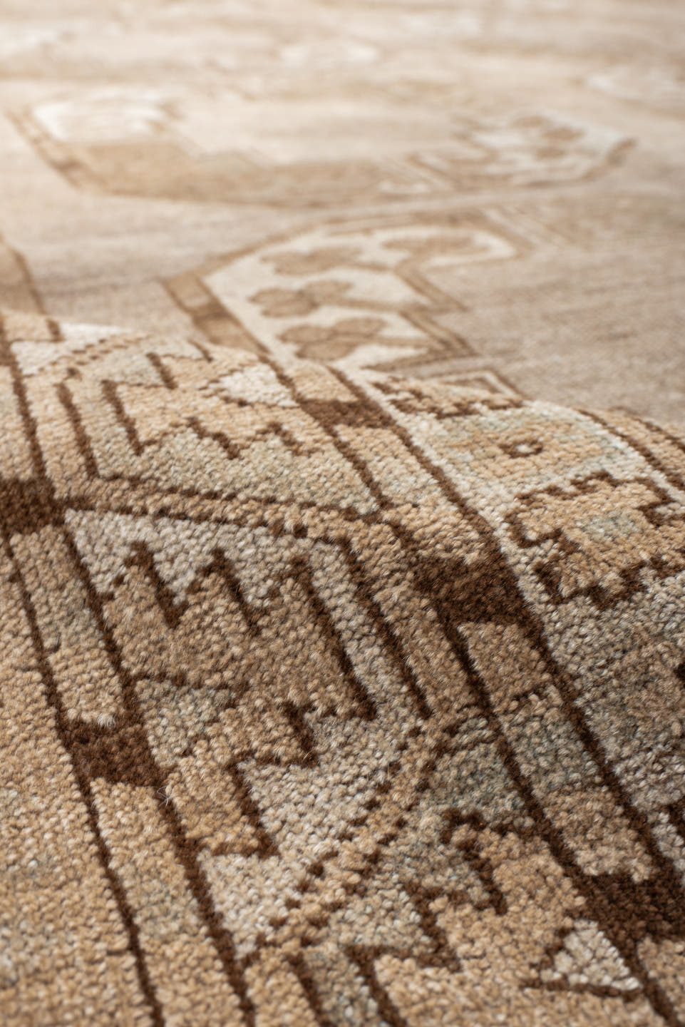 7' x 9' one-of-a-kind handmade antique Afghan rug. Color palette: taupe, camel, beige, ivory, sand, light brown, pale blue