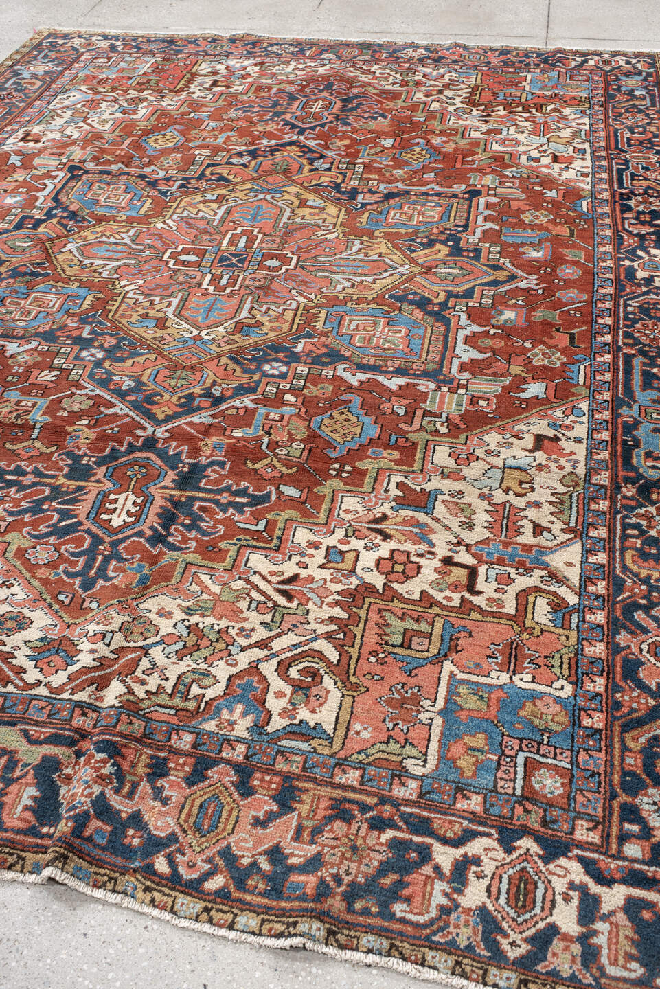 8' x 10' one-of-a-kind handmade antique Heriz large size rug. Color palette: rust, navy, ivory, sky blue, camel, coral, sage