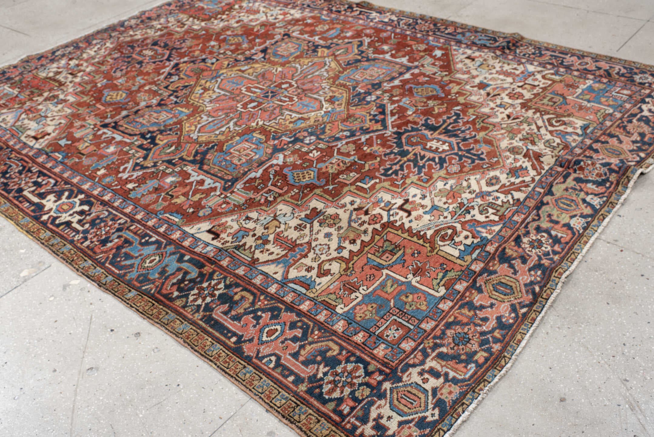 8' x 10' one-of-a-kind handmade antique Heriz large size rug. Color palette: rust, navy, ivory, sky blue, camel, coral, sage