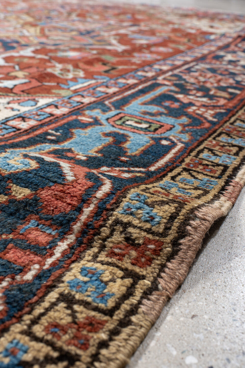 8' x 10' one-of-a-kind handmade antique Heriz large size rug. Color palette: rust, navy, ivory, sky blue, camel, coral, sage