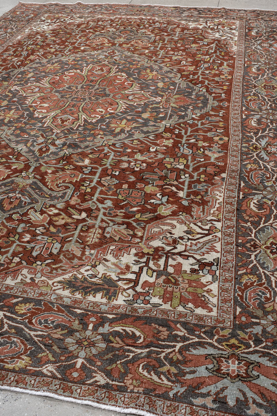 9' x 13' one-of-a-kind handmade vintage Heriz large size rug. Color palette: rust, slate, ivory, terra cotta, sage, charcoal