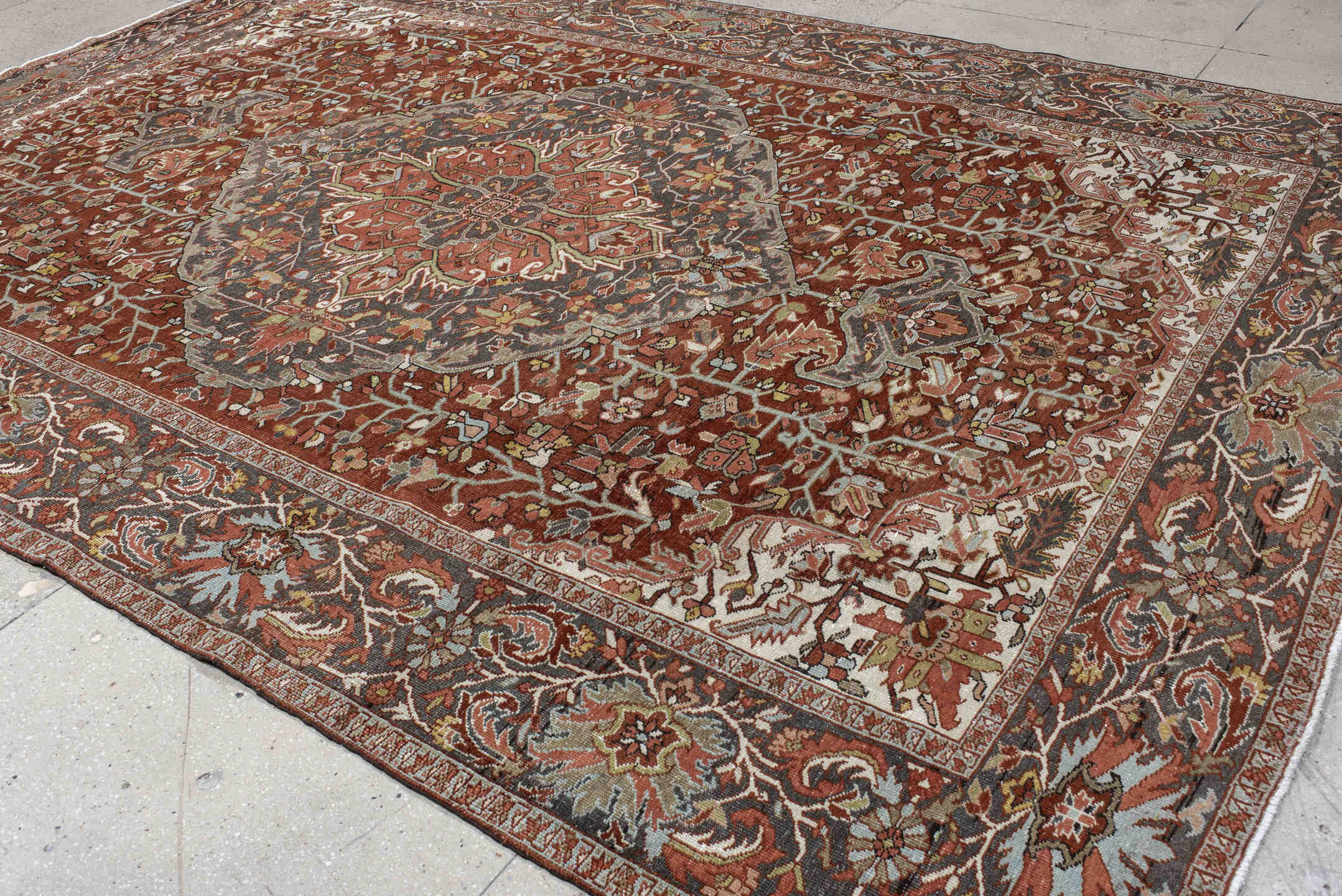 9' x 13' one-of-a-kind handmade vintage Heriz large size rug. Color palette: rust, slate, ivory, terra cotta, sage, charcoal
