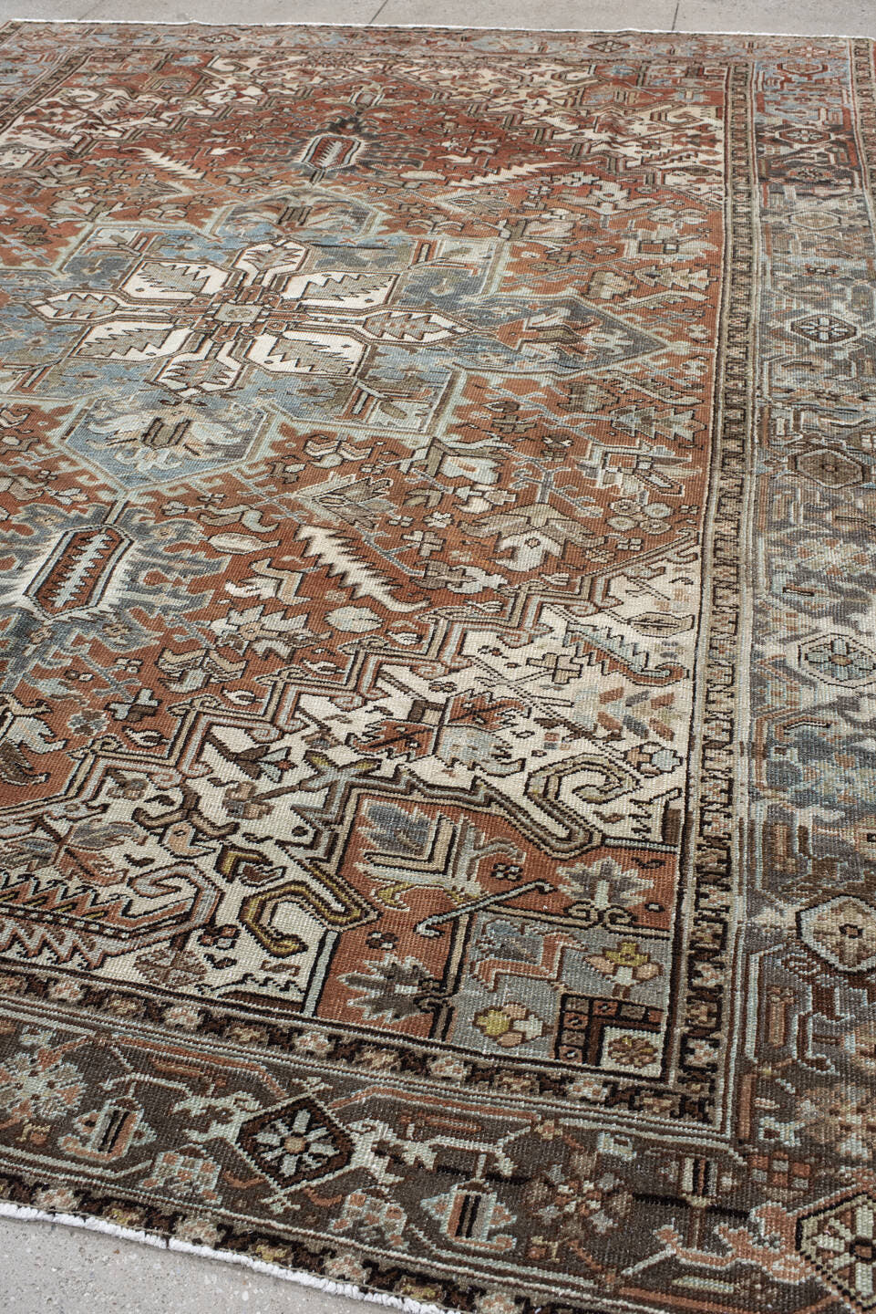 9' x 12' one-of-a-kind handmade vintage Heriz large size rug. Color palette: terra cotta, sky blue, ivory, charcoal, taupe