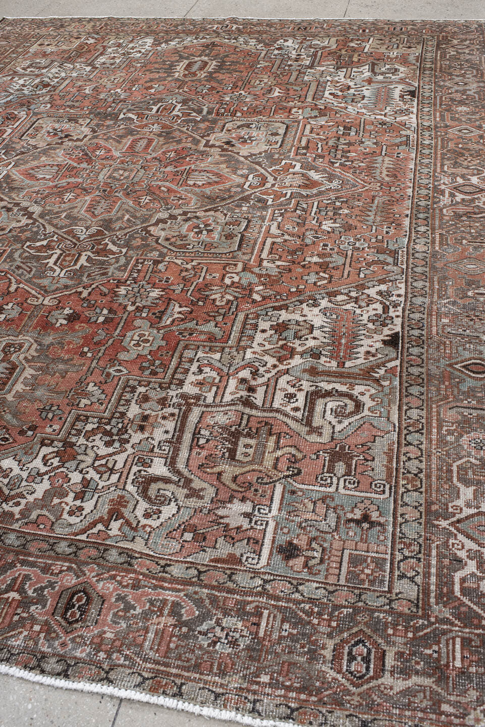 9' x 12' one-of-a-kind handmade antique Heriz large size rug. Color palette: rust, ivory, charcoal, taupe, terra cotta