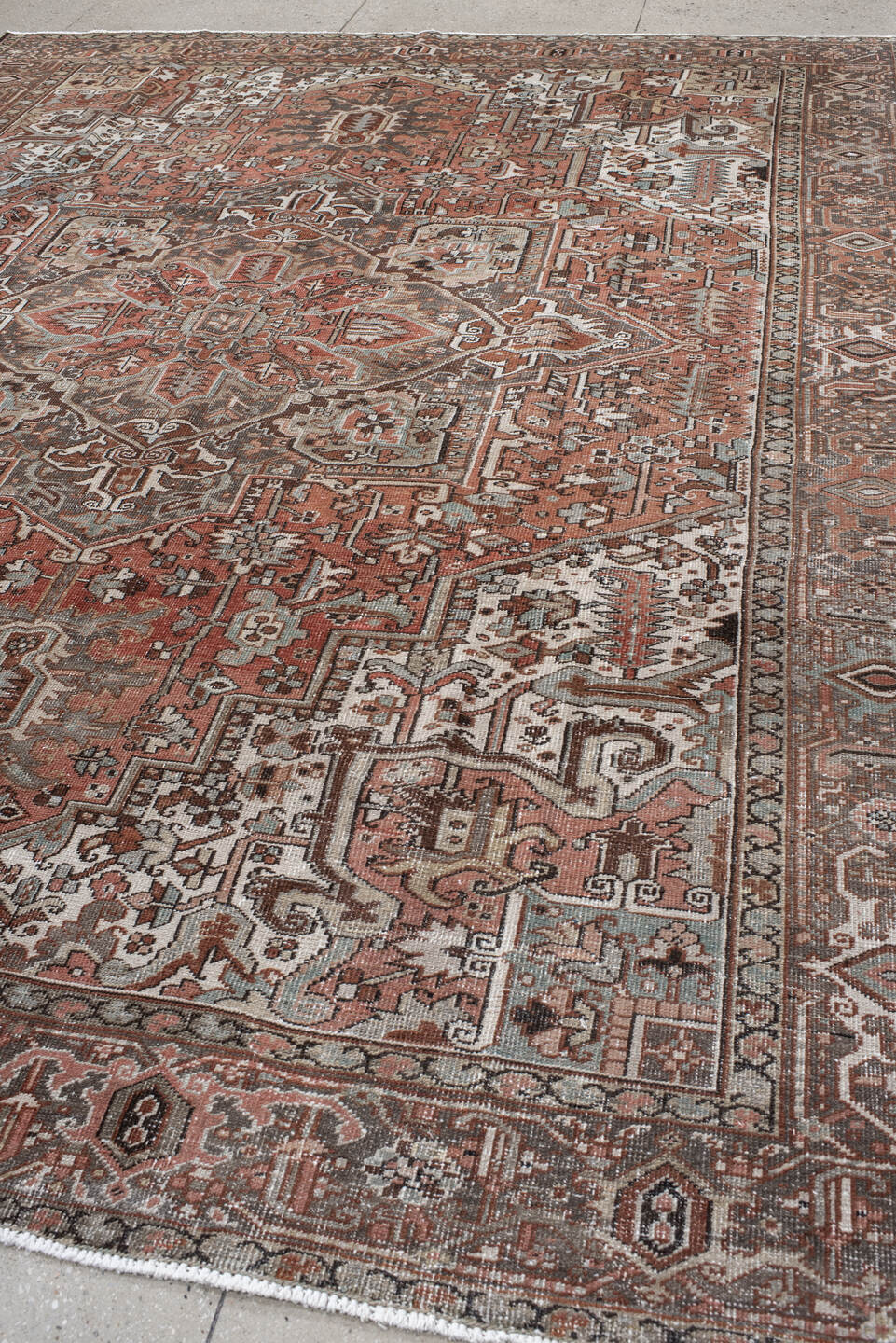 9' x 12' one-of-a-kind handmade antique Heriz large size rug. Color palette: rust, ivory, charcoal, taupe, terra cotta