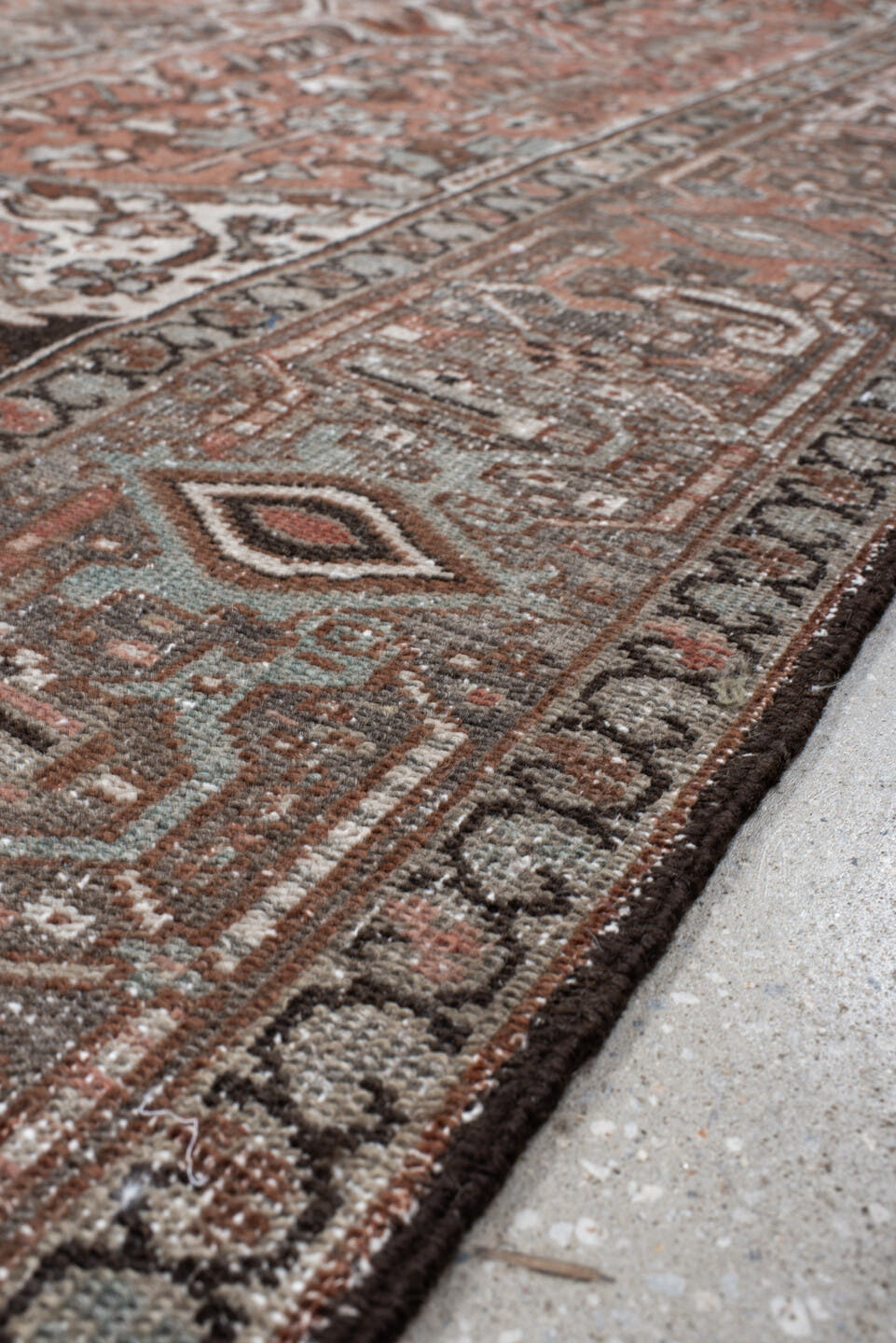 9' x 12' one-of-a-kind handmade antique Heriz large size rug. Color palette: rust, ivory, charcoal, taupe, terra cotta