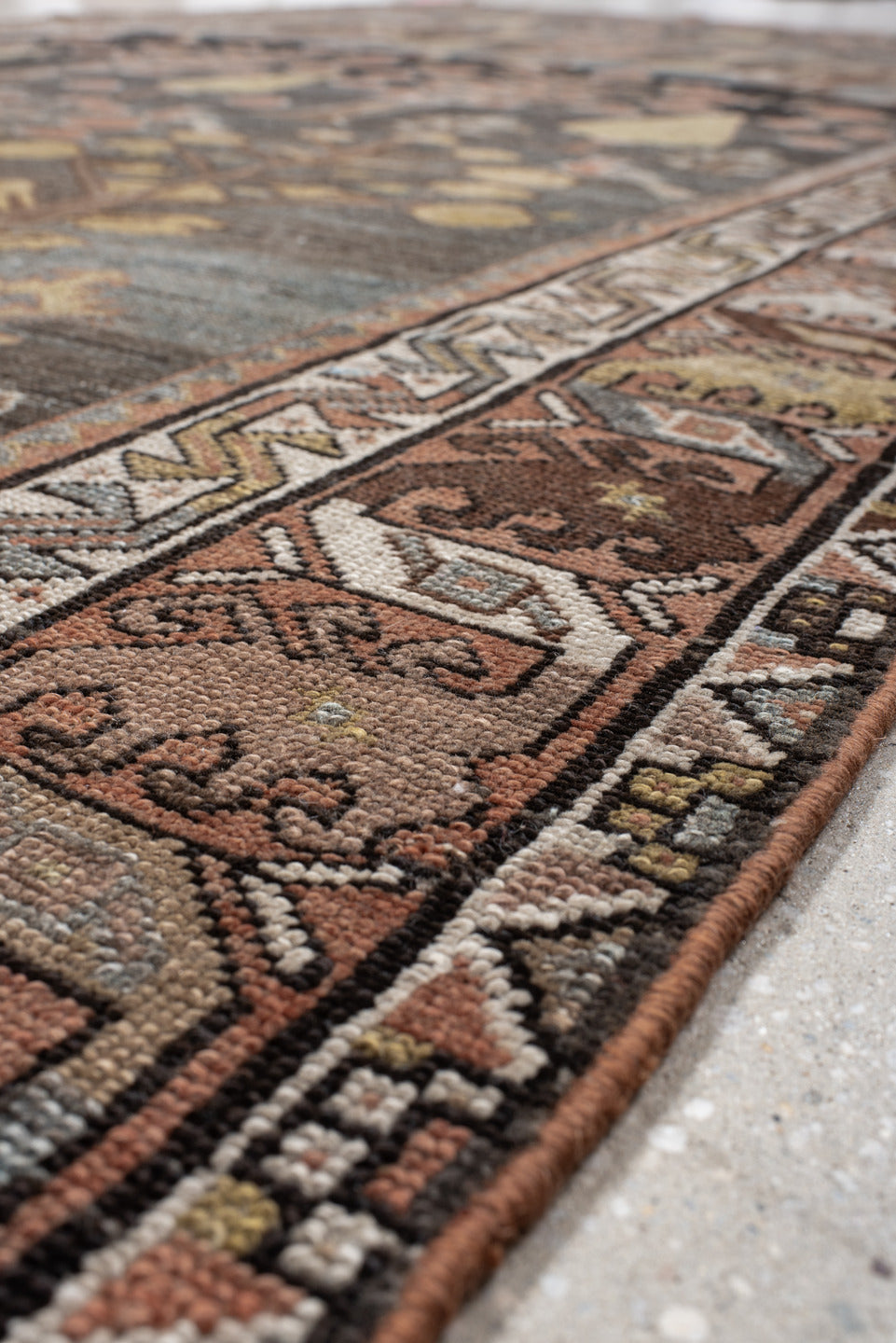 6' x 12' one-of-a-kind handmade vintage Baktiary large size rug. Color palette: gray, brown, pink, off-white, light gray