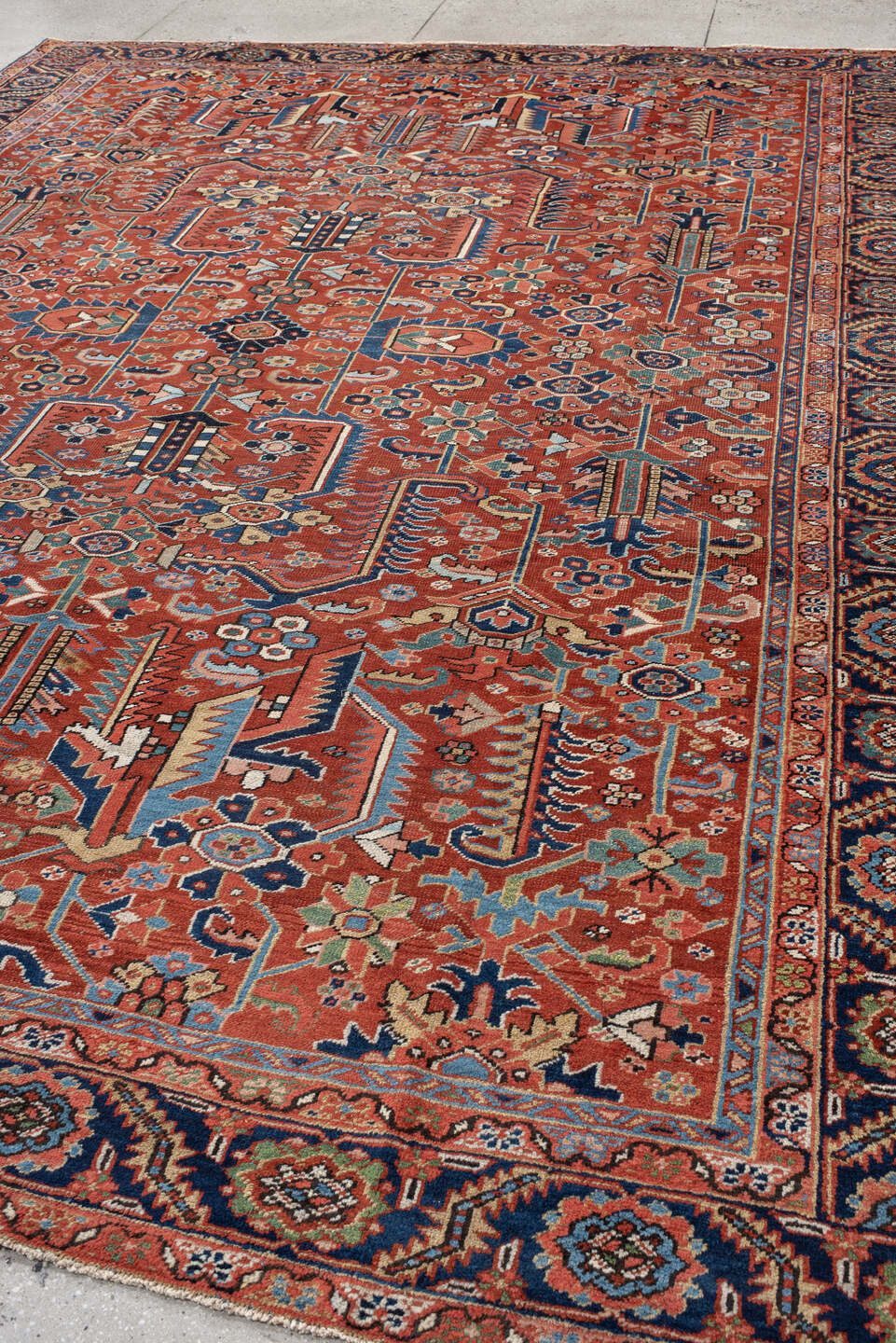 9' x 12' one-of-a-kind handmade antique Heriz large size rug. Color palette: rust, navy, ivory, sky_blue, coral, sage, camel
