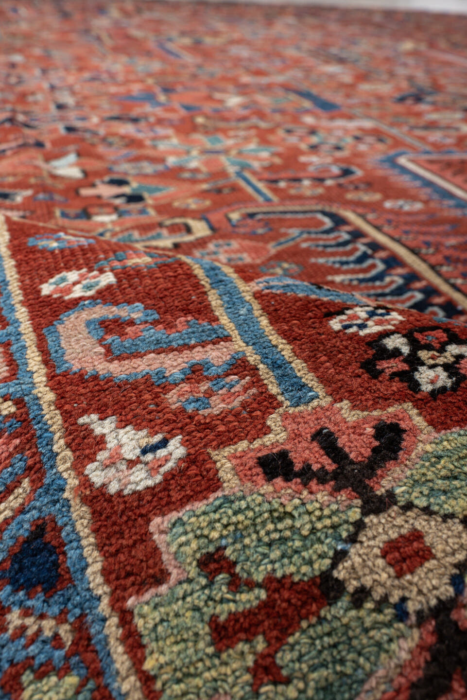 9' x 12' one-of-a-kind handmade antique Heriz large size rug. Color palette: rust, navy, ivory, sky_blue, coral, sage, camel