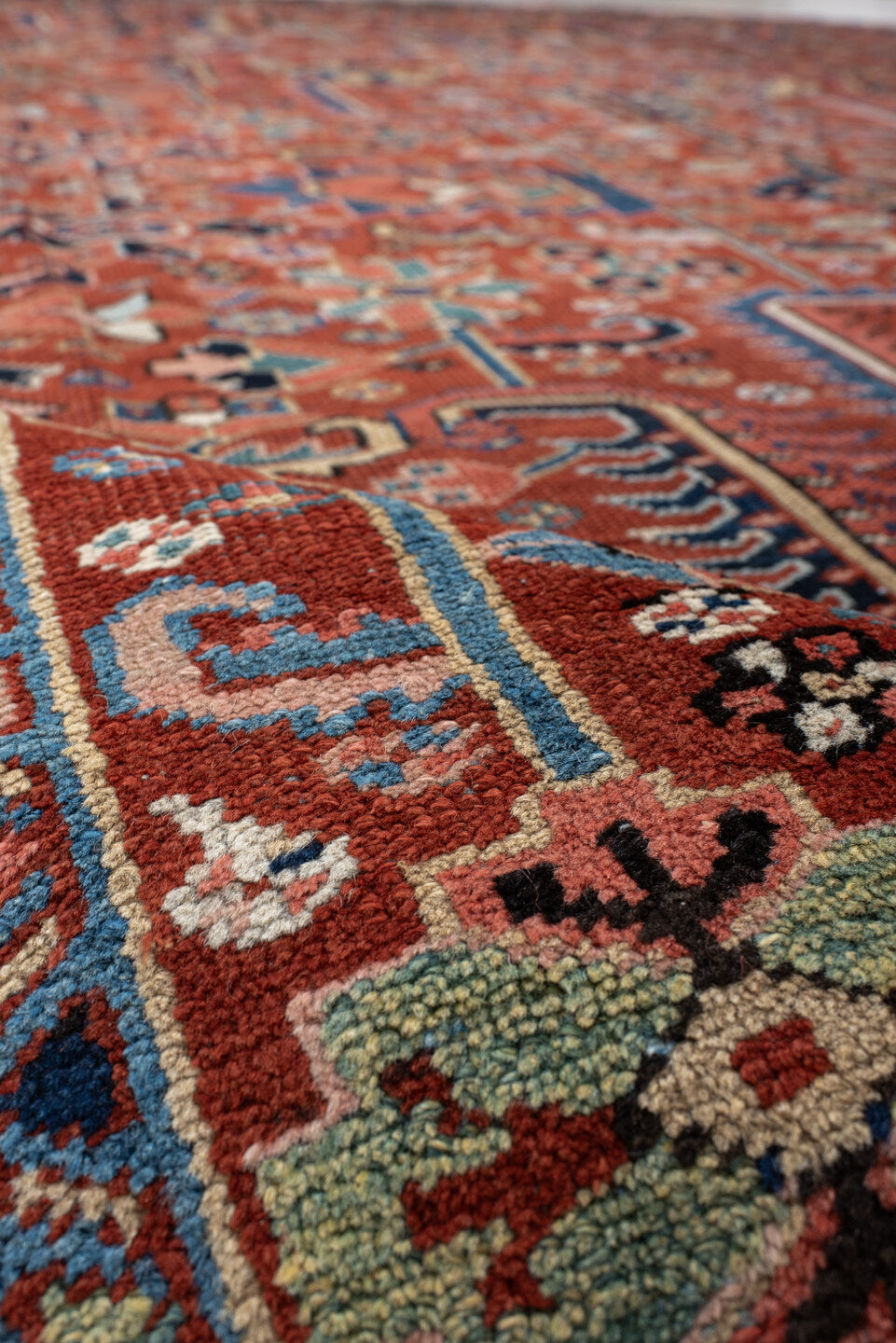 9' x 12' one-of-a-kind handmade antique Heriz large size rug. Color palette: rust, navy, ivory, sky_blue, coral, sage, camel