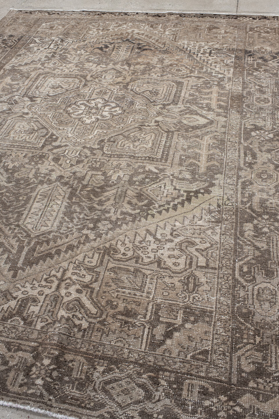 7' x 10' one-of-a-kind handmade antique Heriz large size rug. Color palette: taupe, brown, ivory, charcoal, beige, gray
