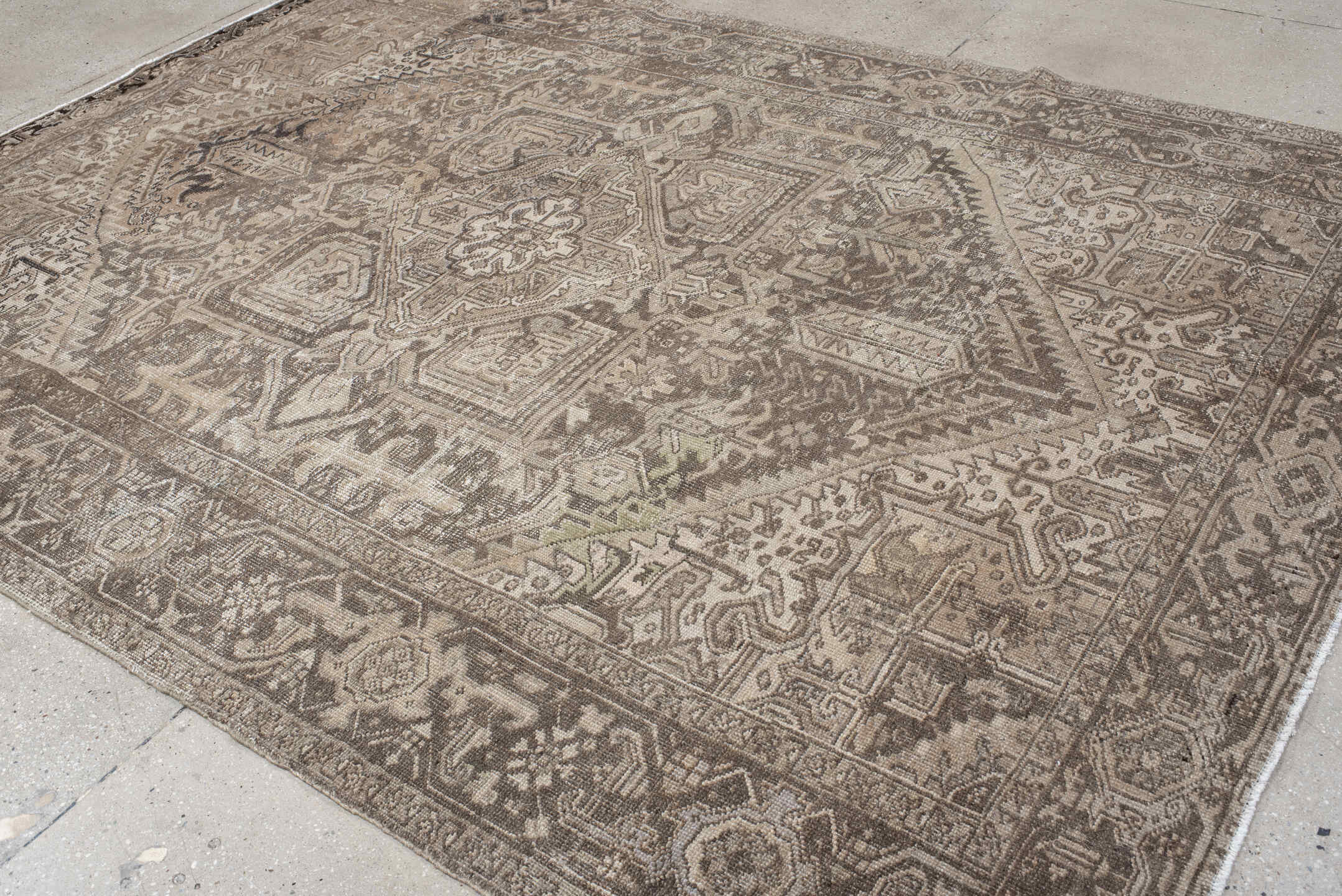 7' x 10' one-of-a-kind handmade antique Heriz large size rug. Color palette: taupe, brown, ivory, charcoal, beige, gray