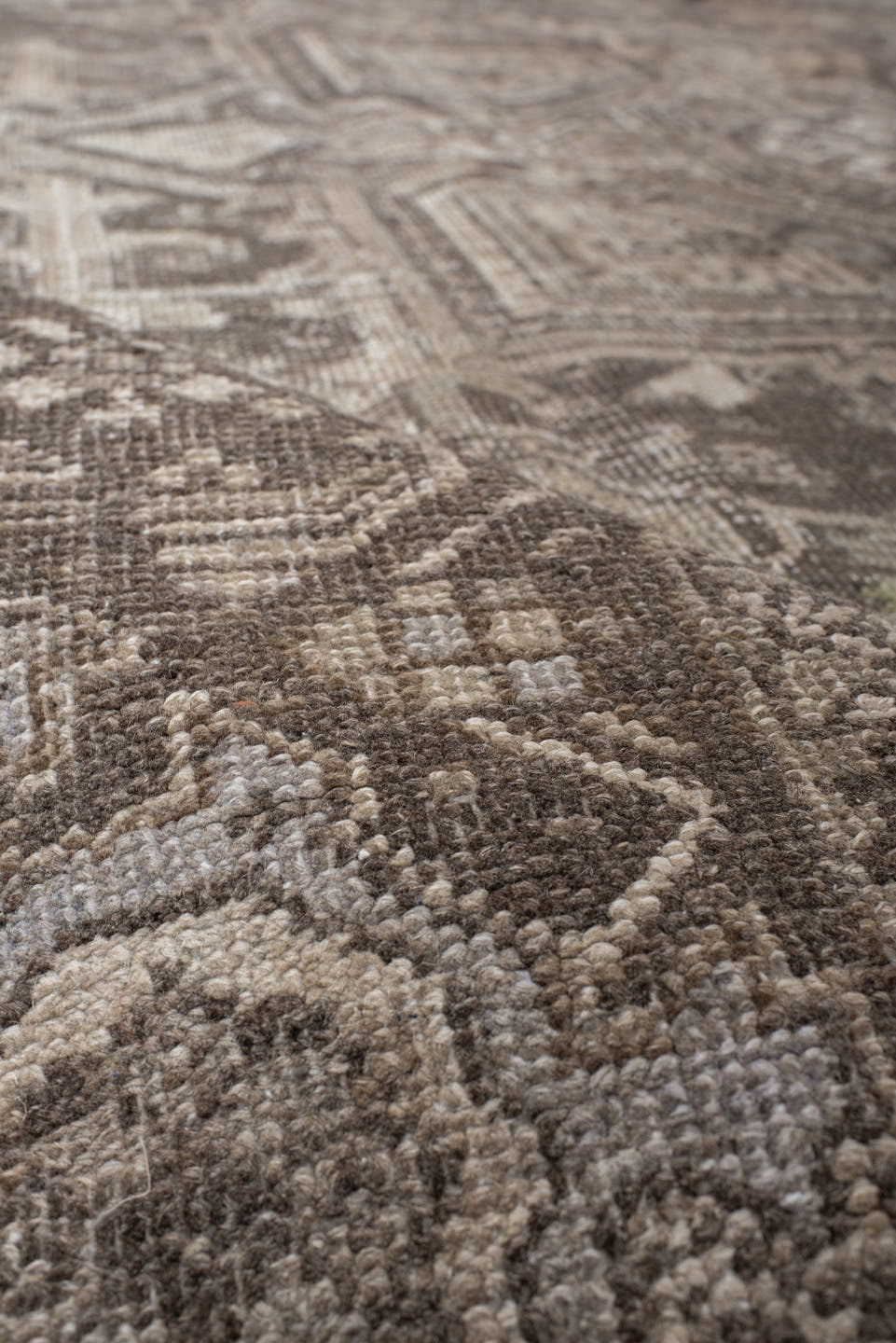 7' x 10' one-of-a-kind handmade antique Heriz large size rug. Color palette: taupe, brown, ivory, charcoal, beige, gray