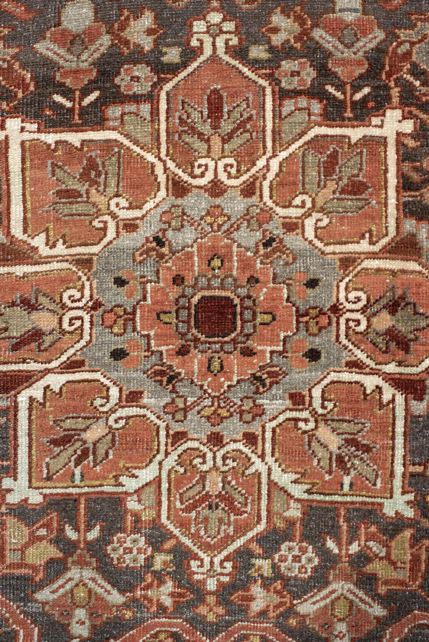 7' x 11' one-of-a-kind handmade antique Heriz large size rug. Color palette: rust, brick, slate, ivory, camel, taupe