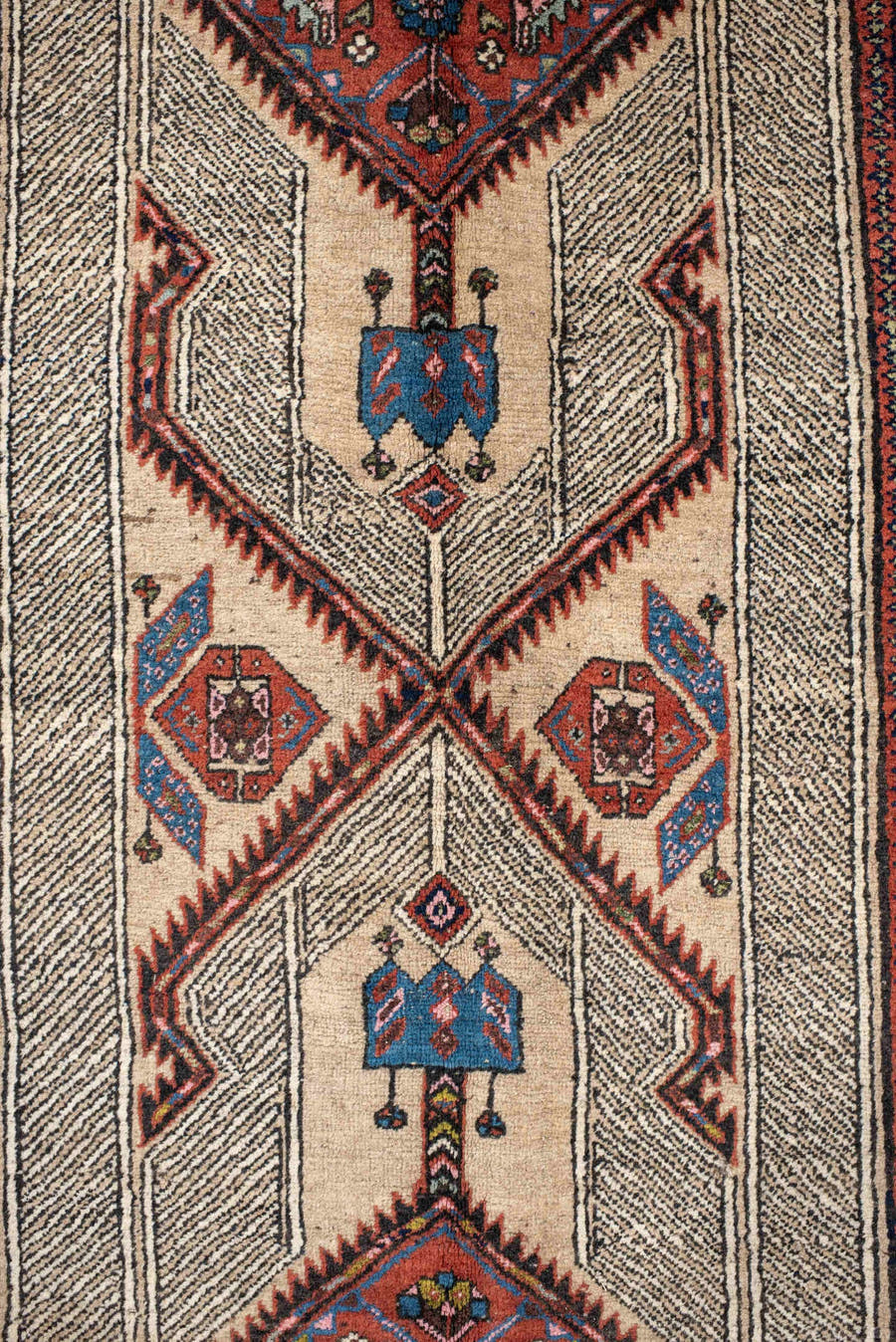 4' x 11' one-of-a-kind handmade antique Sarab runner rug. Color palette: ivory, rust, indigo, navy, crimson, camel, saffron