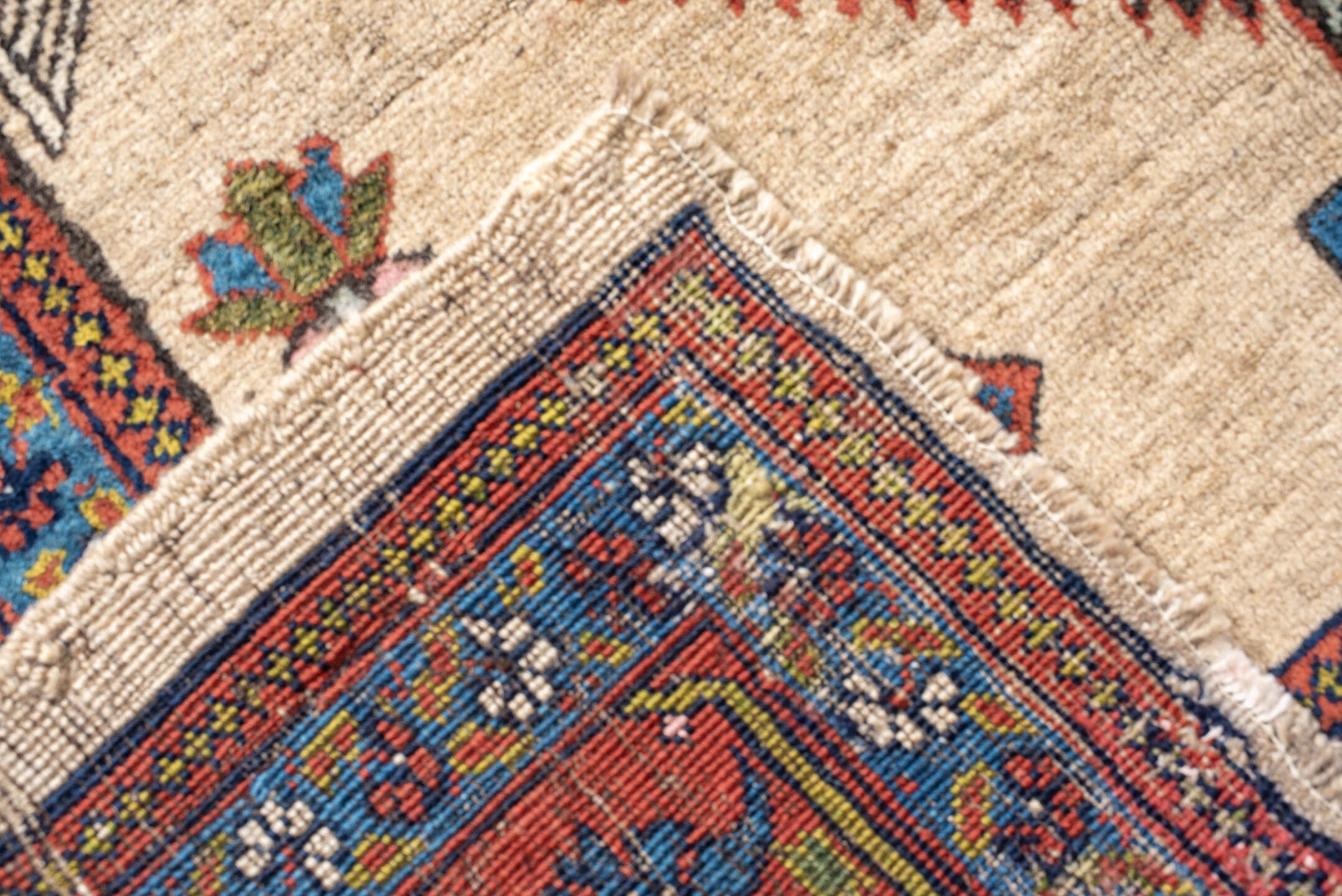 4' x 11' one-of-a-kind handmade antique Sarab runner rug. Color palette: ivory, rust, indigo, navy, crimson, camel, saffron