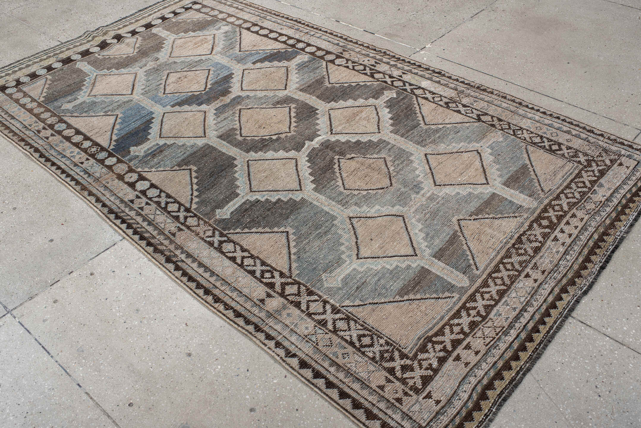 4' x 8' one-of-a-kind handmade vintage Gabbe rug. Color palette: ivory, blue, charcoal, taupe, brown, camel, gray, black