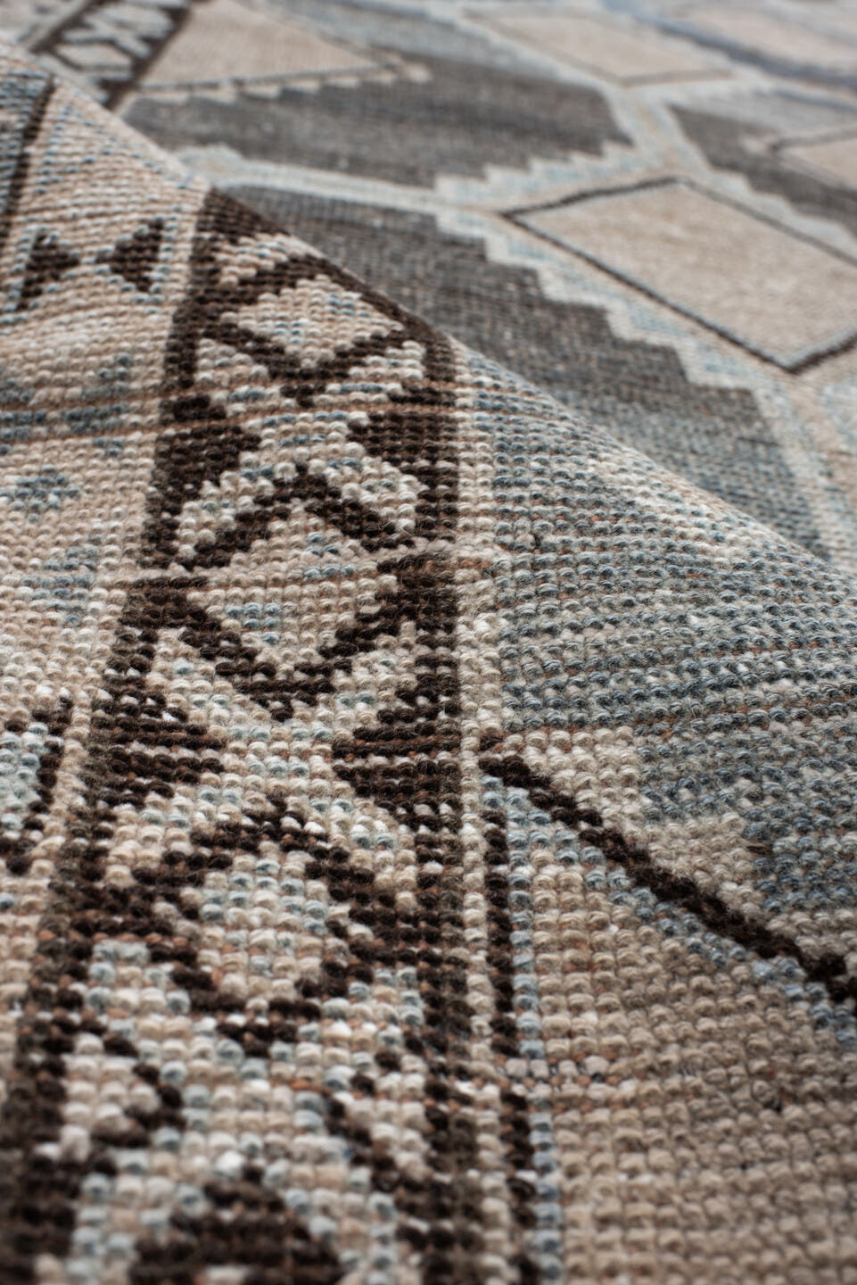 4' x 8' one-of-a-kind handmade vintage Gabbe rug. Color palette: ivory, blue, charcoal, taupe, brown, camel, gray, black