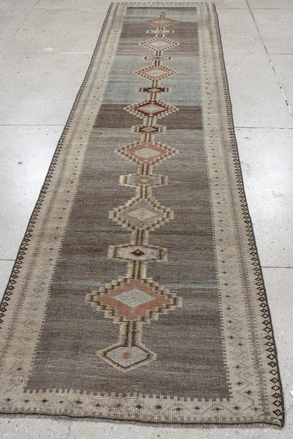 2' x 11' one-of-a-kind handmade vintage Gabbe runner rug. Color palette: taupe, ivory, slate, camel, rose, brown, beige