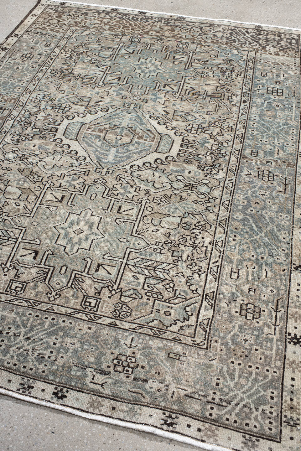 5' x 6' one-of-a-kind handmade vintage Karaje rug. Color palette: ivory, pale blue, taupe, charcoal, beige, slate