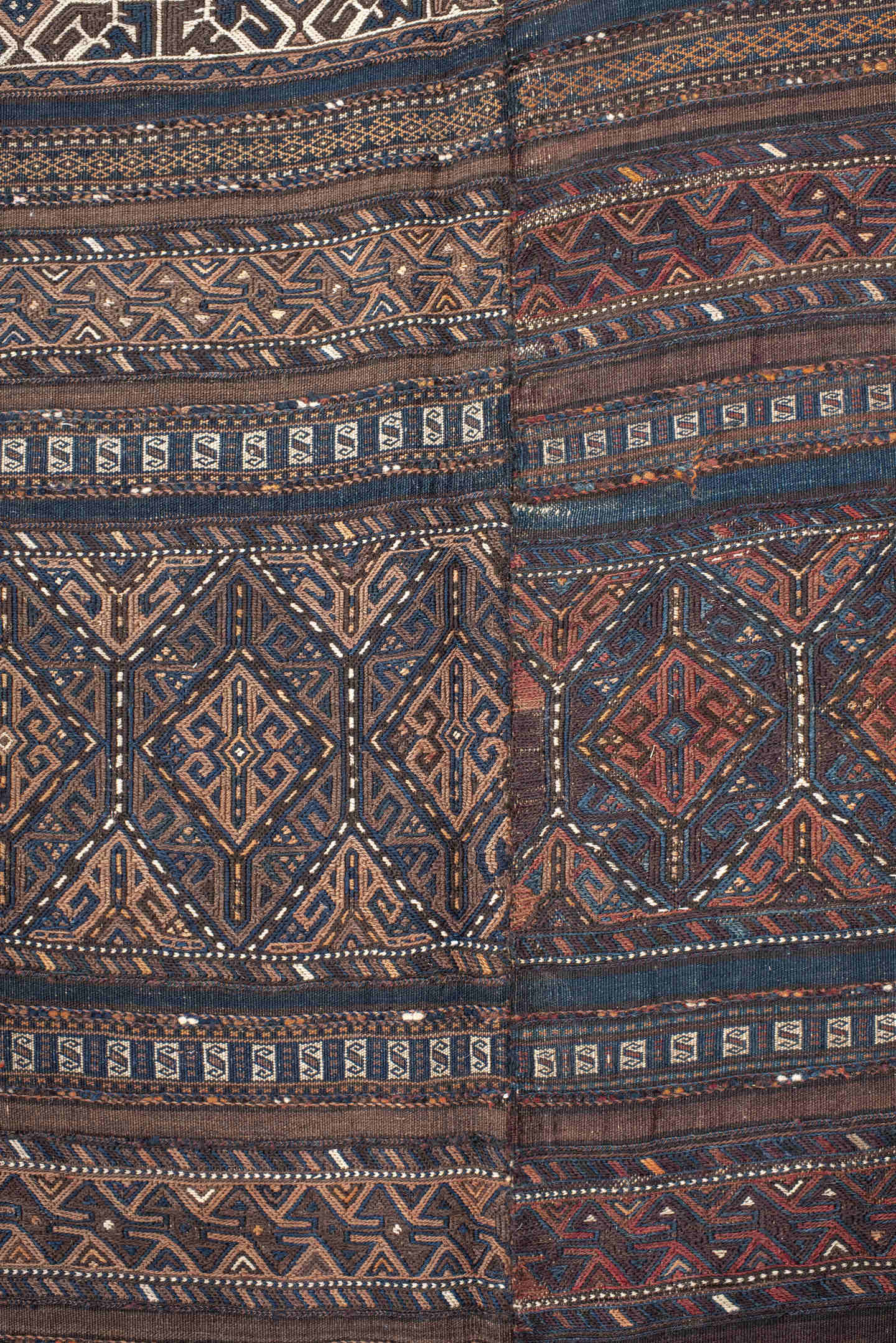 5' x 11' one-of-a-kind handmade vintage Kilim rug. Color palette: brown, indigo, rust, camel, ivory, charcoal, purple