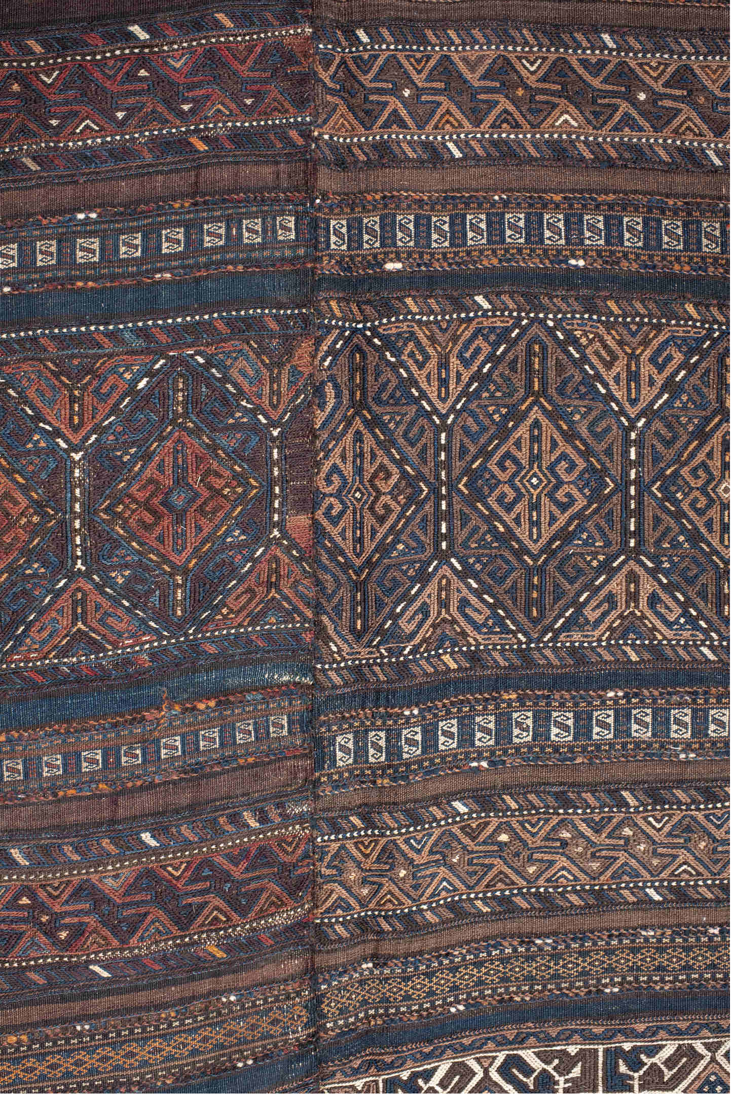 5' x 11' one-of-a-kind handmade vintage Kilim rug. Color palette: brown, indigo, rust, camel, ivory, charcoal, purple