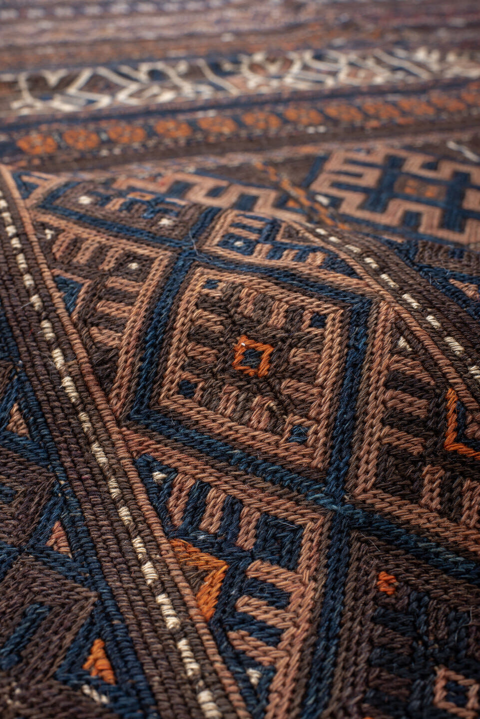 5' x 11' one-of-a-kind handmade vintage Kilim rug. Color palette: brown, indigo, rust, camel, ivory, charcoal, purple