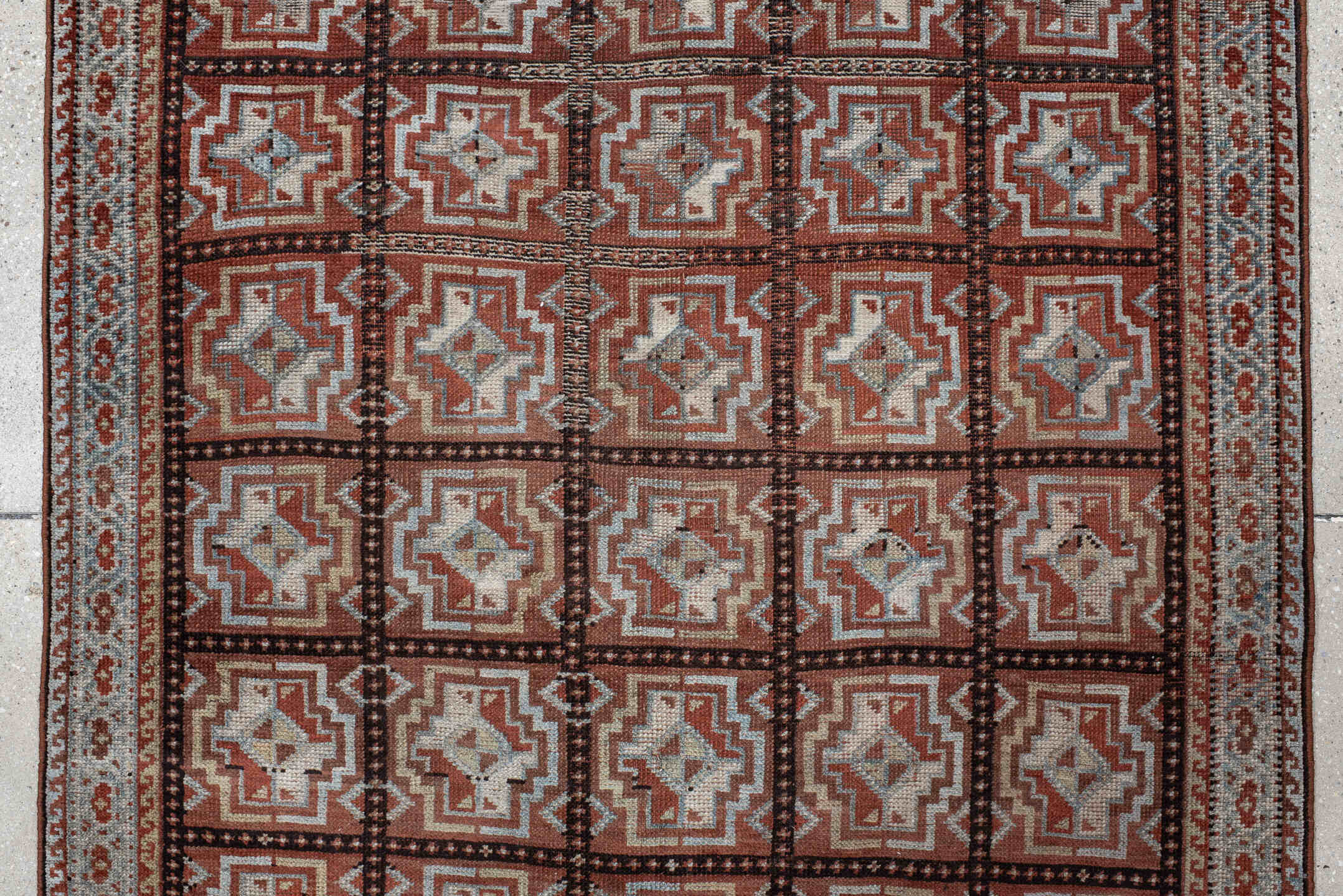 3' x 7' one-of-a-kind handmade vintage Kurd rug. Color palette: rust, ivory, light blue, charcoal, terracotta, camel, brown